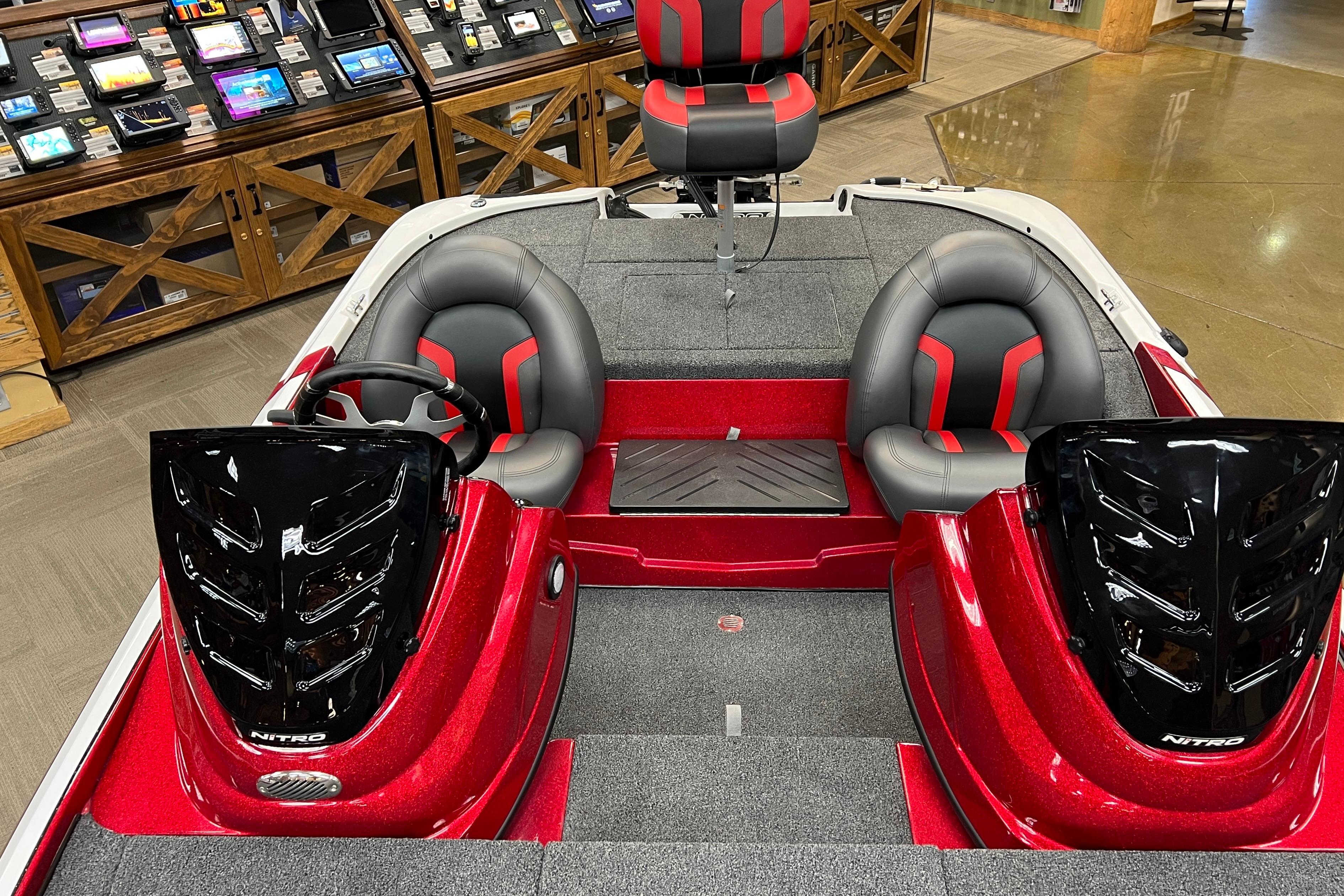 2026 Nitro Z17 boat interior with red and black seating, dual consoles, and modern dashboard.