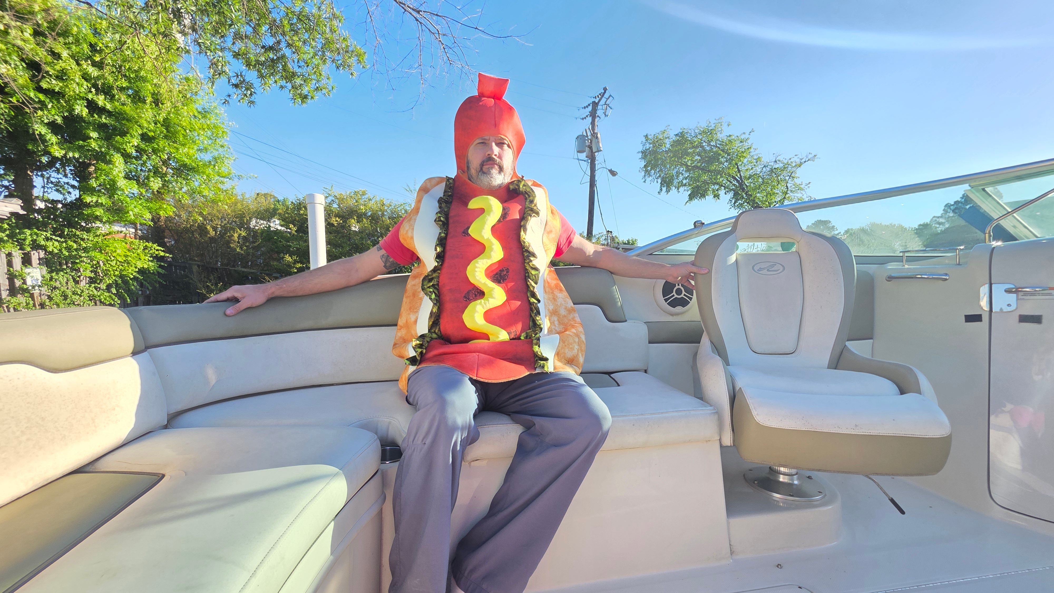 Man in hotdog costume on 2007 Sea Ray 260 Sundeck boat.