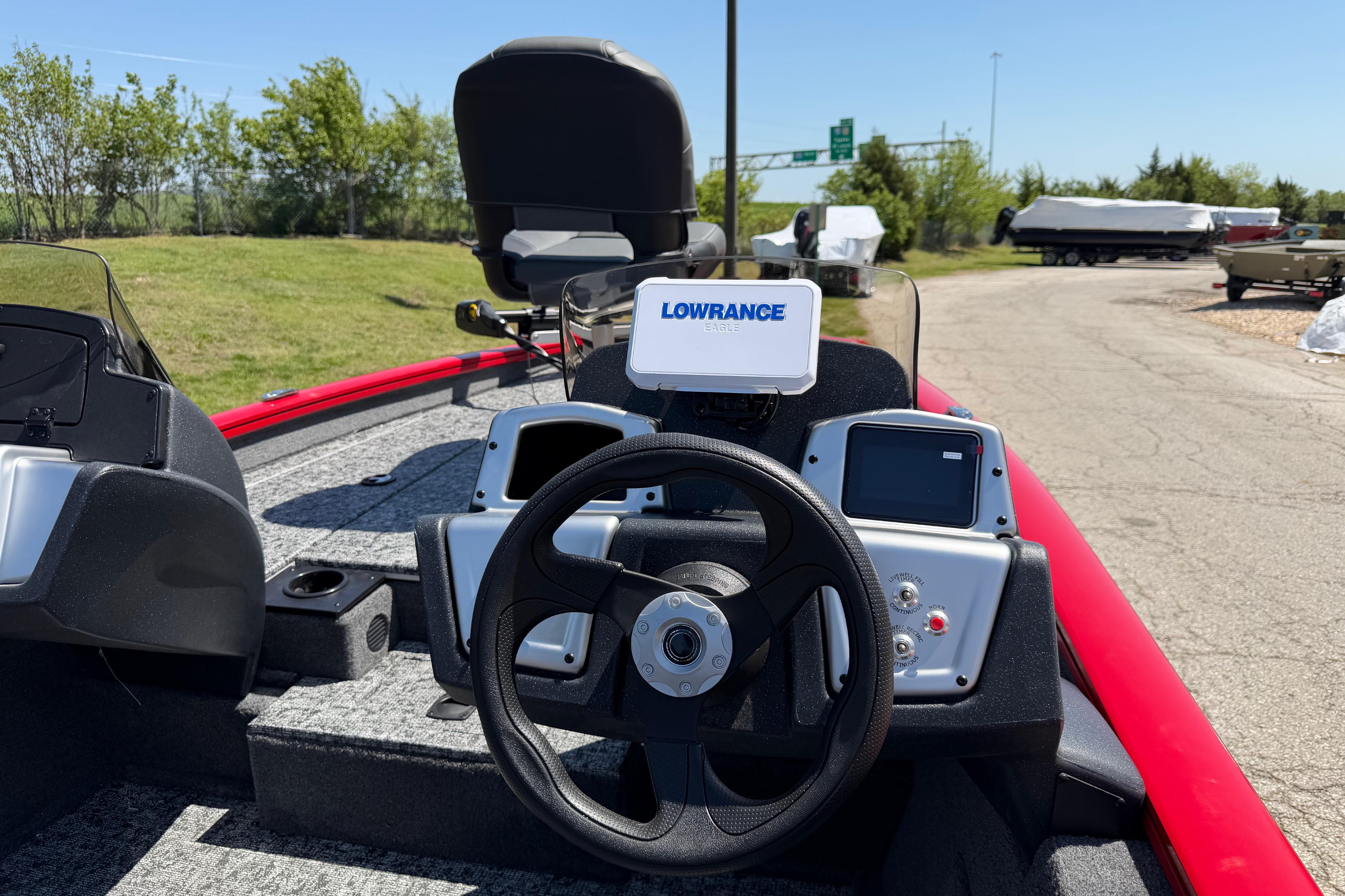 2026 Tracker Pro Team 175 boat dashboard with Lowrance electronics and steering wheel.