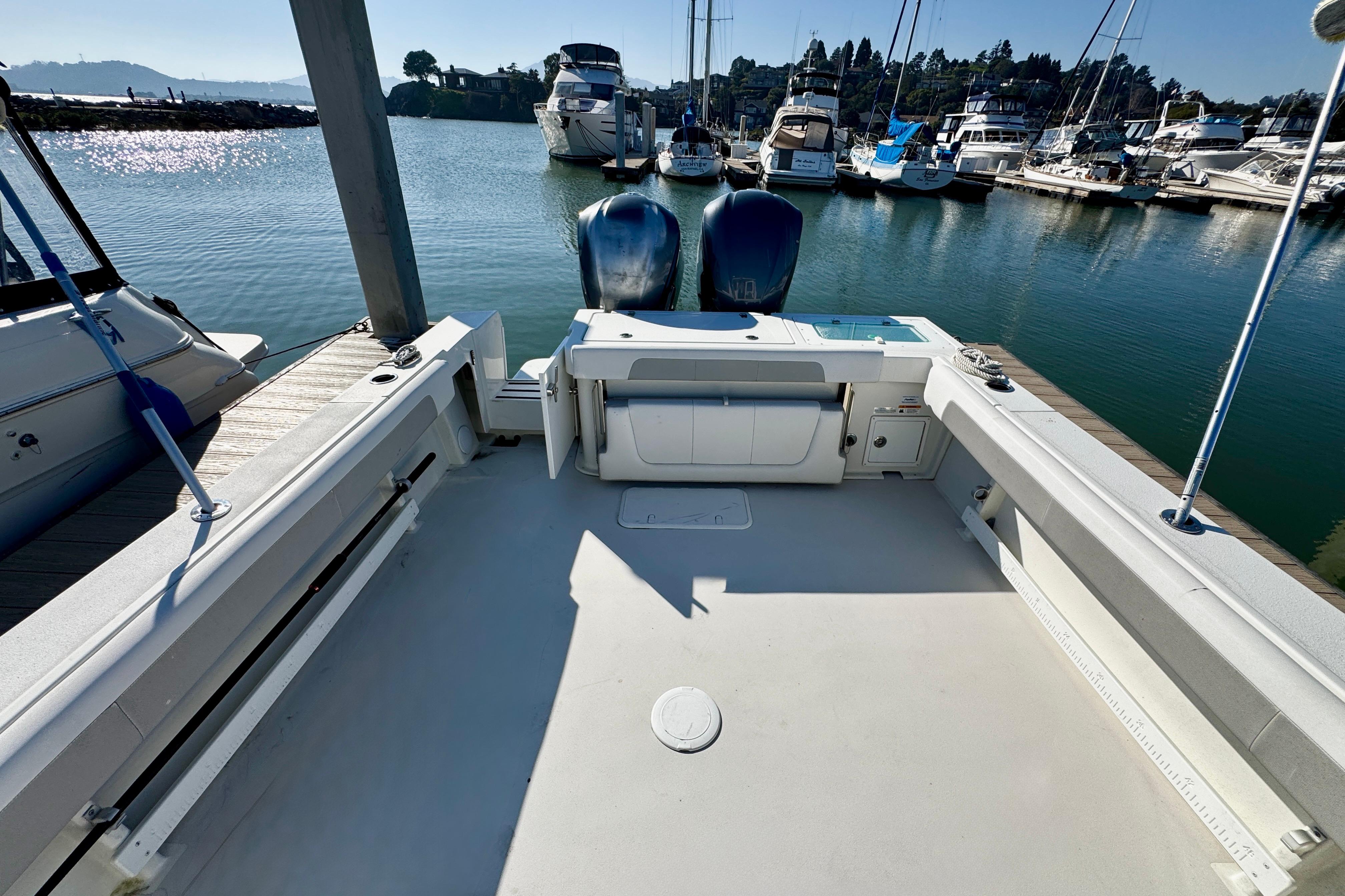 2021 Parker 2820 XLD Sport Cabin docked at marina with twin engines.