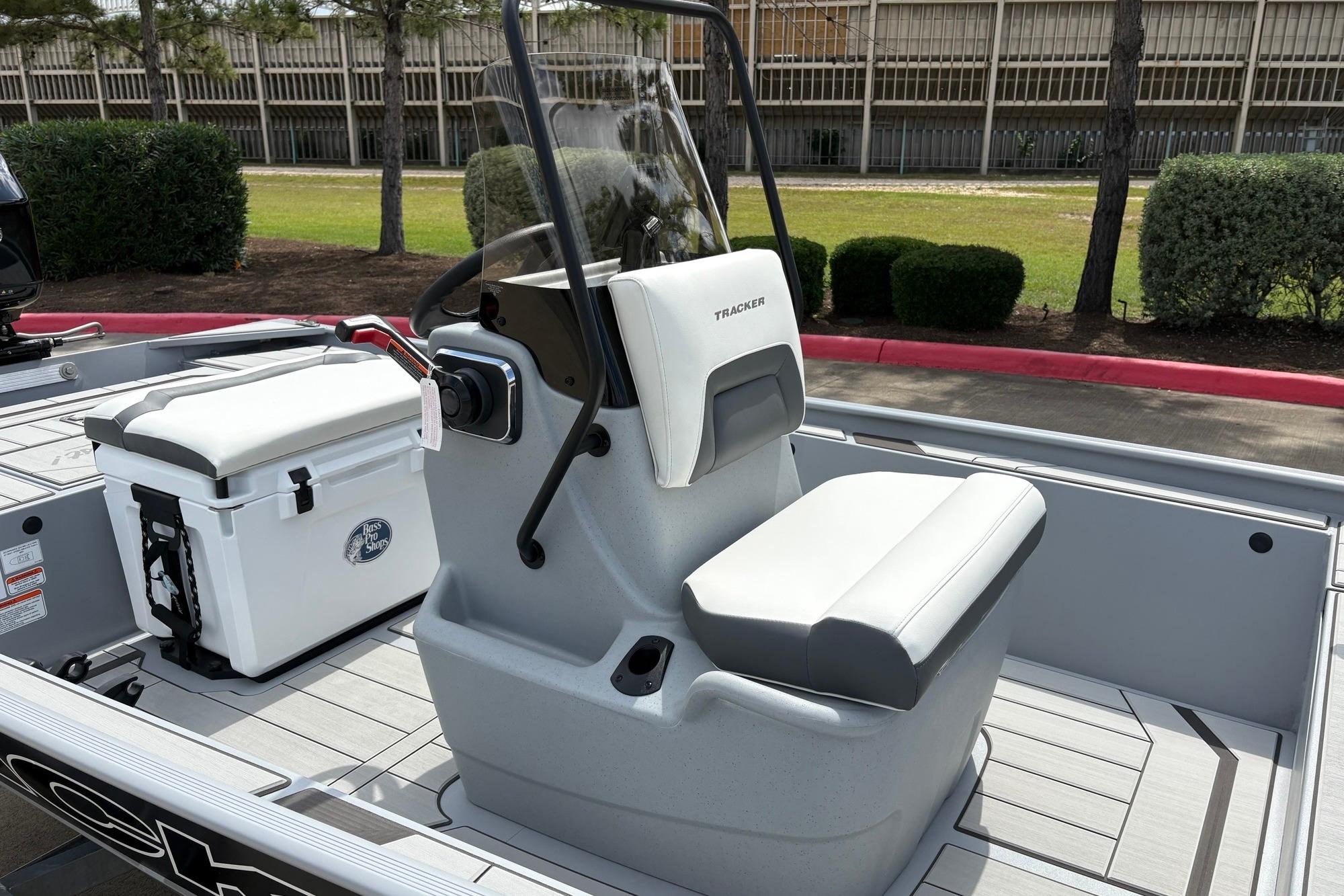 2026 Tracker Bass Tracker Classic CC boat interior with seating and cooler.