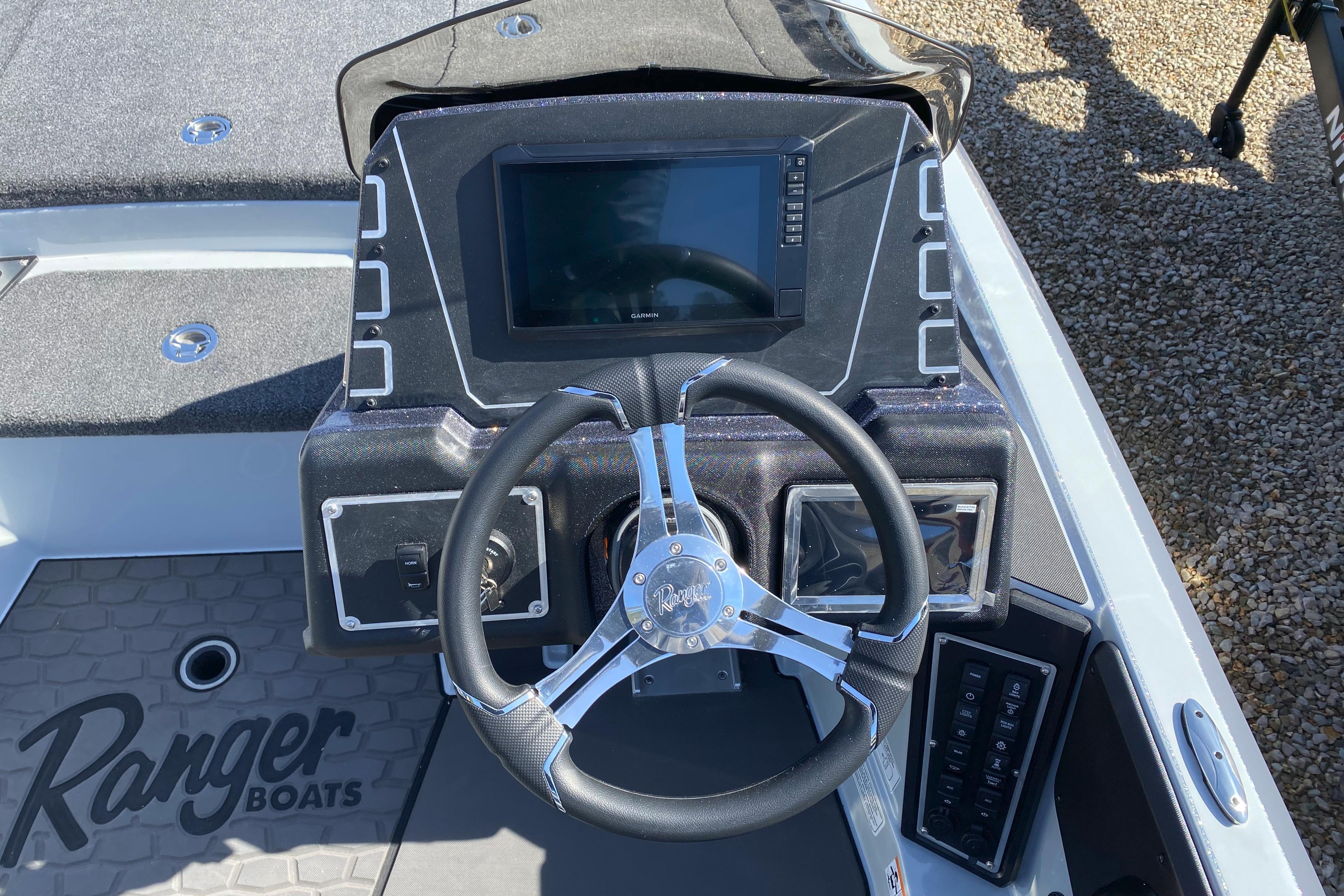 2026 Ranger Z519R boat dashboard with steering wheel and digital display.