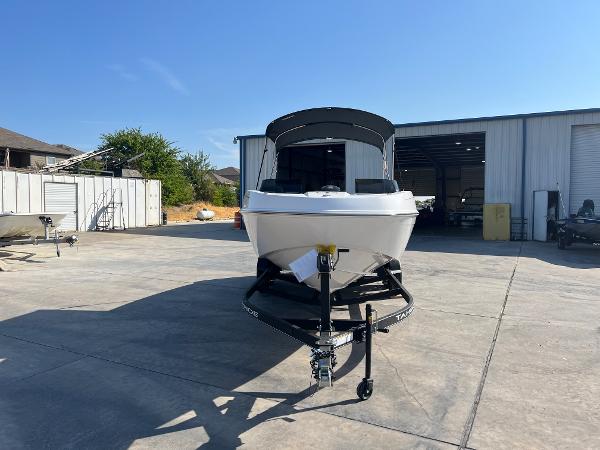 2024 Tahoe T21 boat on trailer in front of a storage facility.