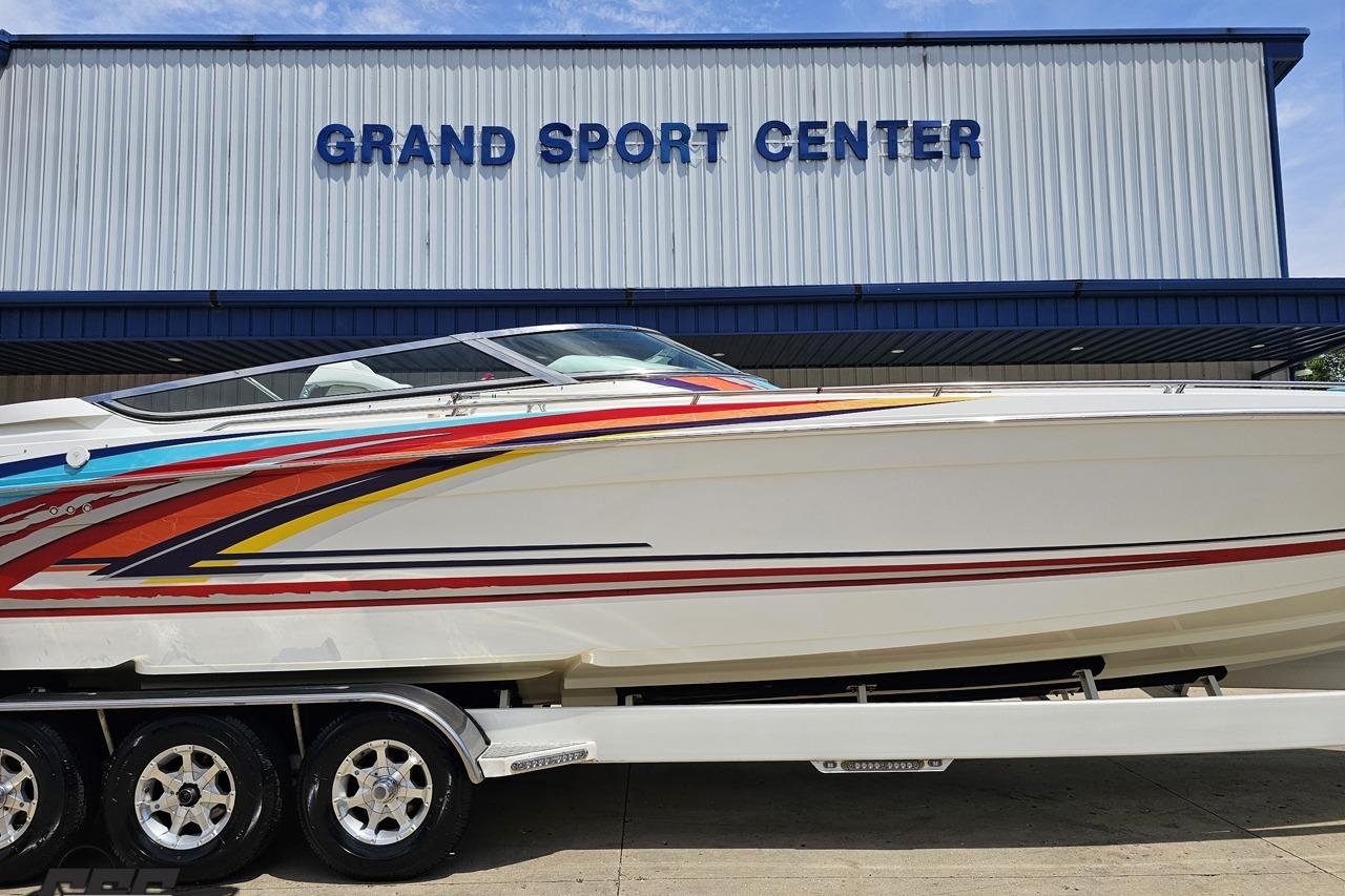2002 Formula 382 FASTech boat with colorful stripes at Grand Sport Center.