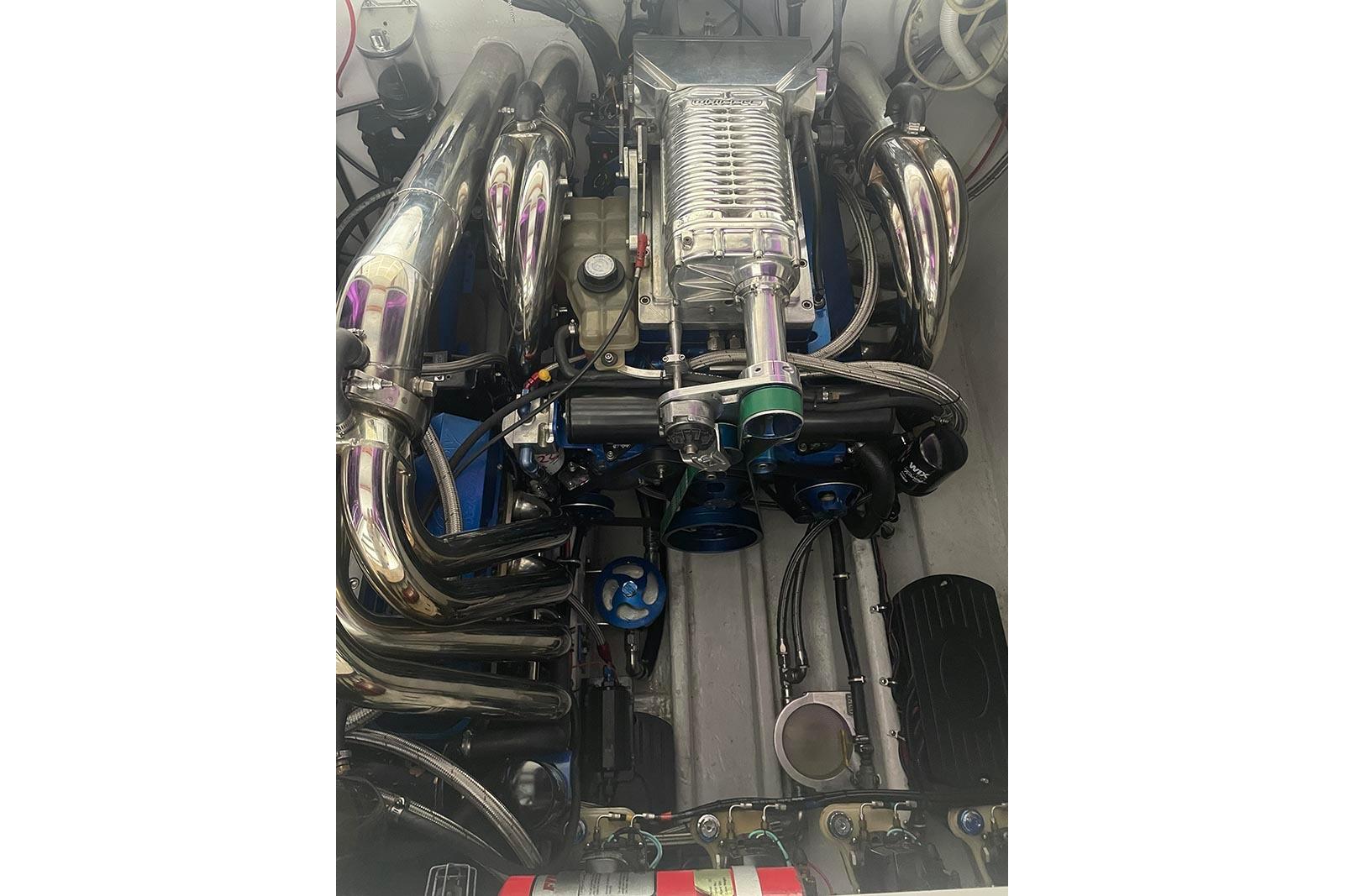 Engine of a 2004 Fountain 38 Lightning boat, showcasing polished components and intricate design.