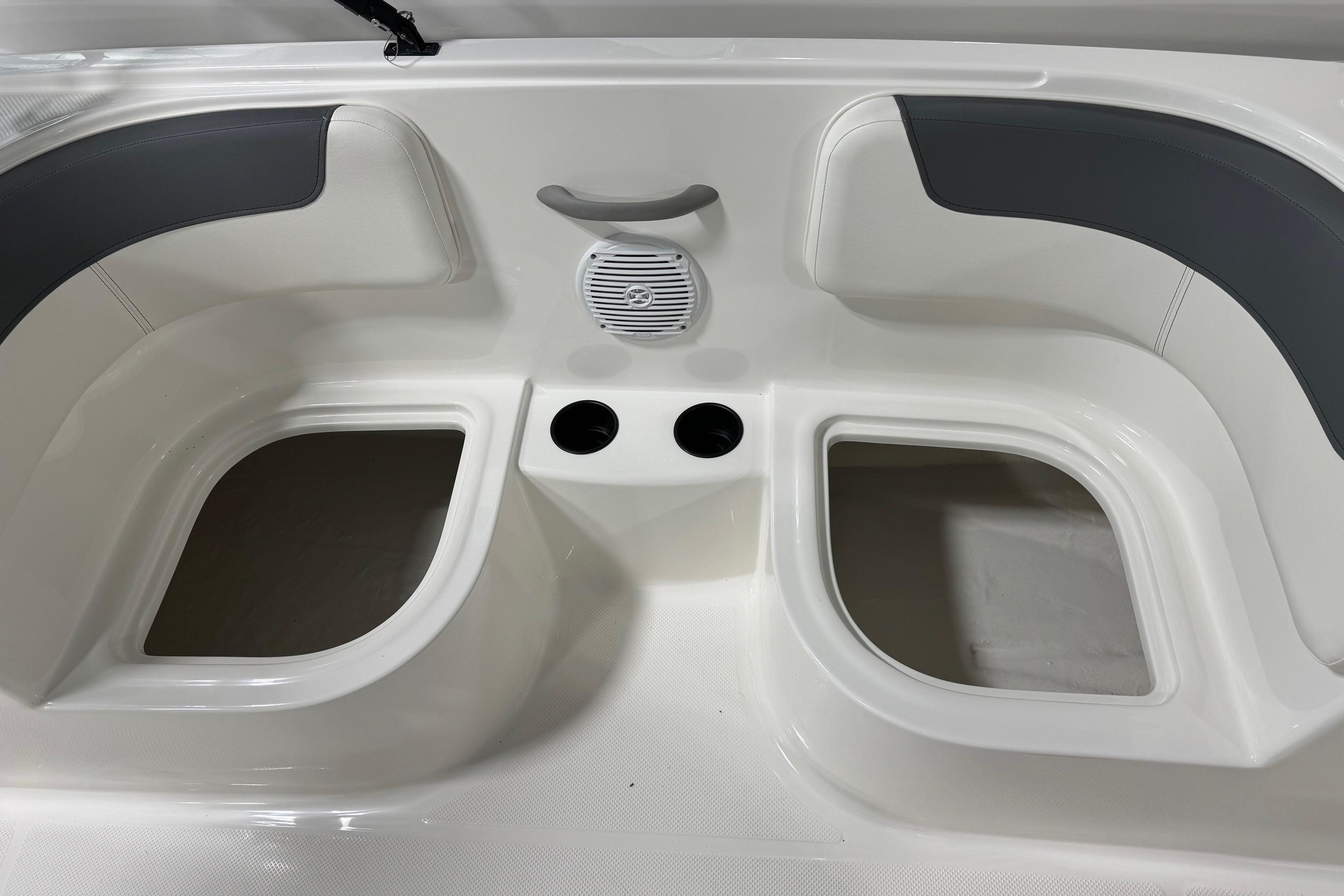 2025 Bayliner Element E18 boat interior with seating and cup holders.
