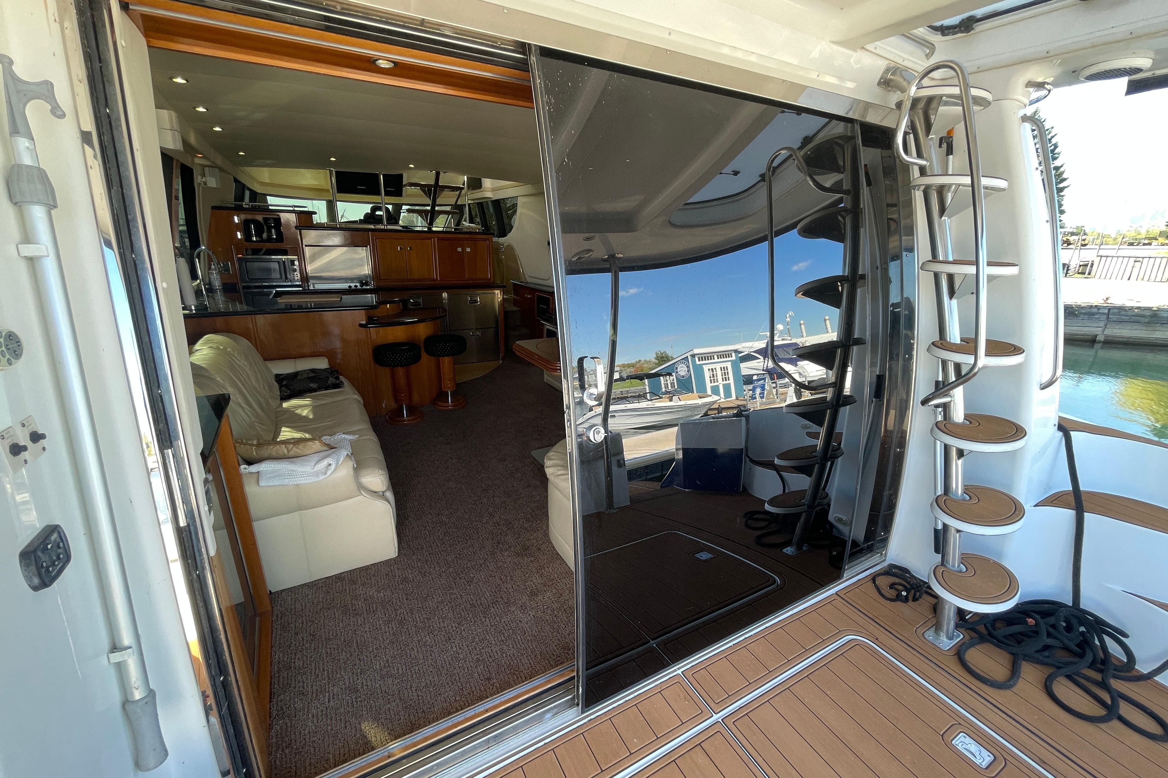 Interior view of 2002 Carver 570 Voyager Pilothouse yacht with modern amenities and spiral staircase.