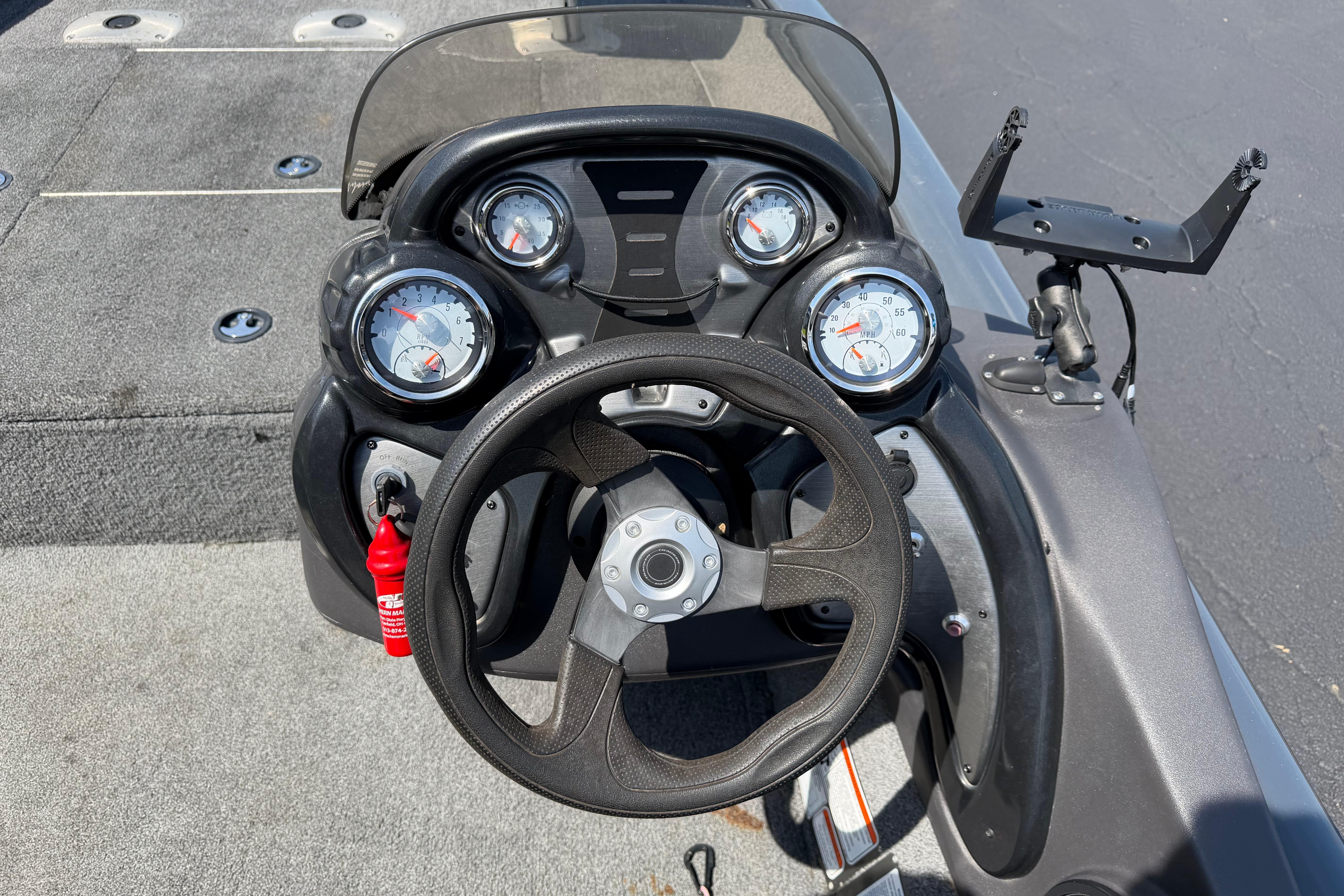 Steering console of 2019 Tracker Pro Team 175 TF boat with gauges and controls.