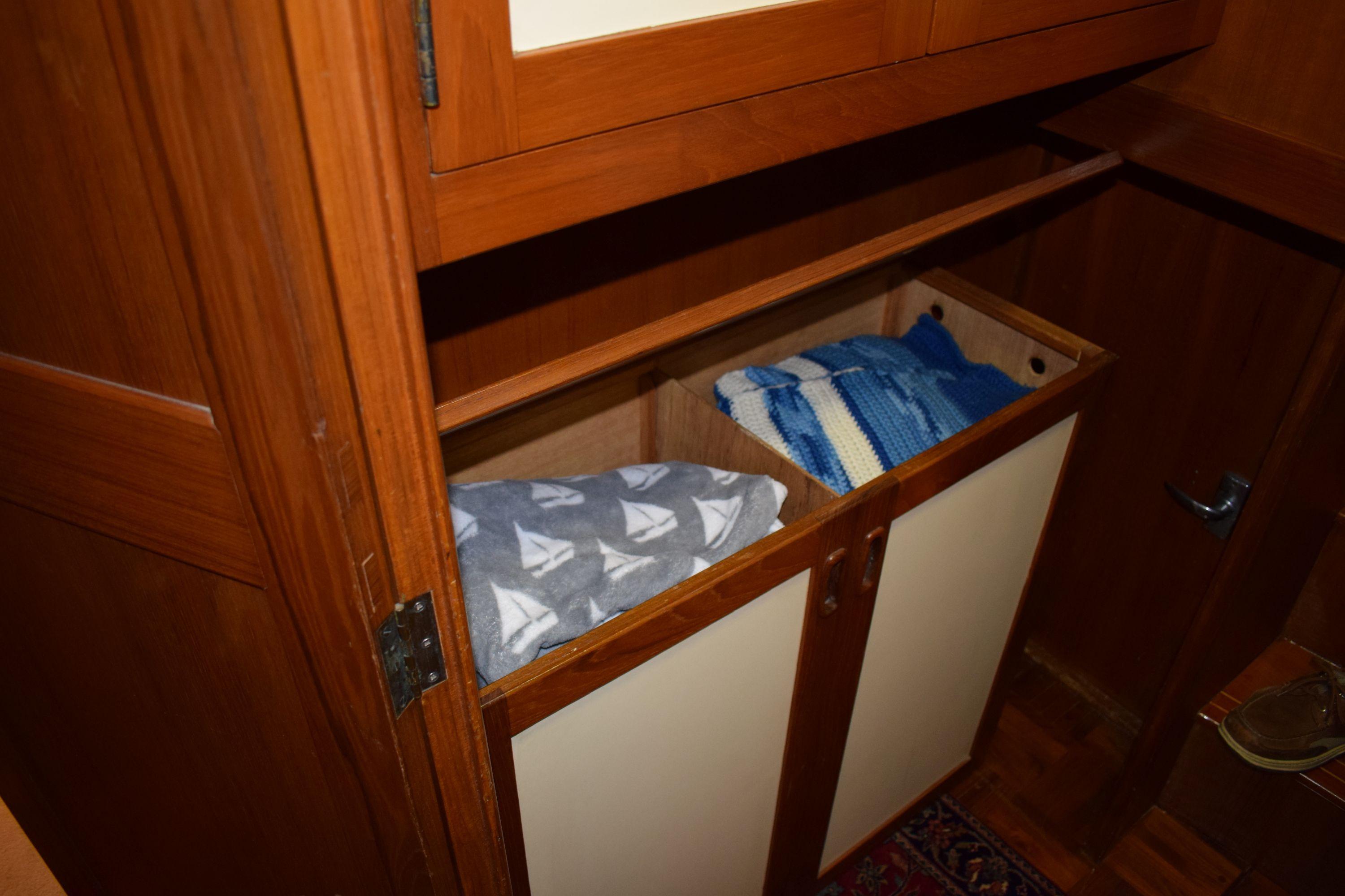 Wooden cabinet with blankets inside a 1980 Cheoy Lee 52 Motorsailer.