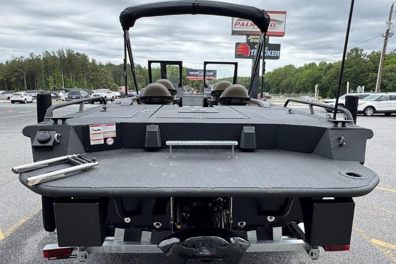 2026 SeaArk Predator 300 AK boat, rear view, parked outdoors on a cloudy day.