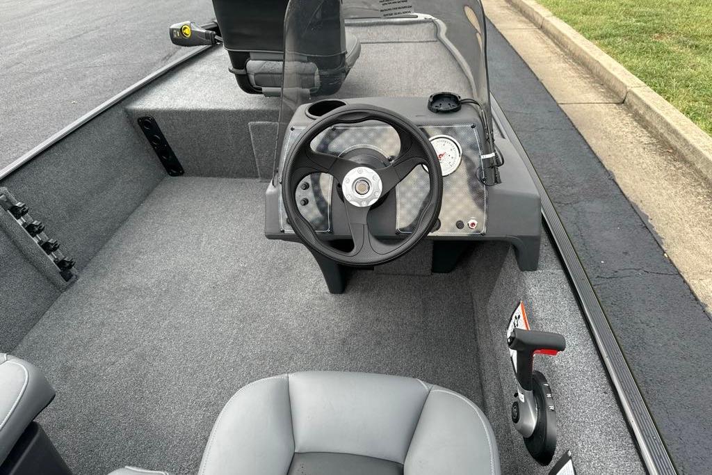 2026 Tracker Bass Tracker Classic XL boat interior with steering wheel and dashboard controls.