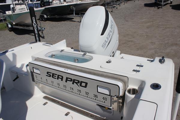 2023 Sea Pro 239 Center Console boat with Suzuki outboard motor, featuring a measuring board.