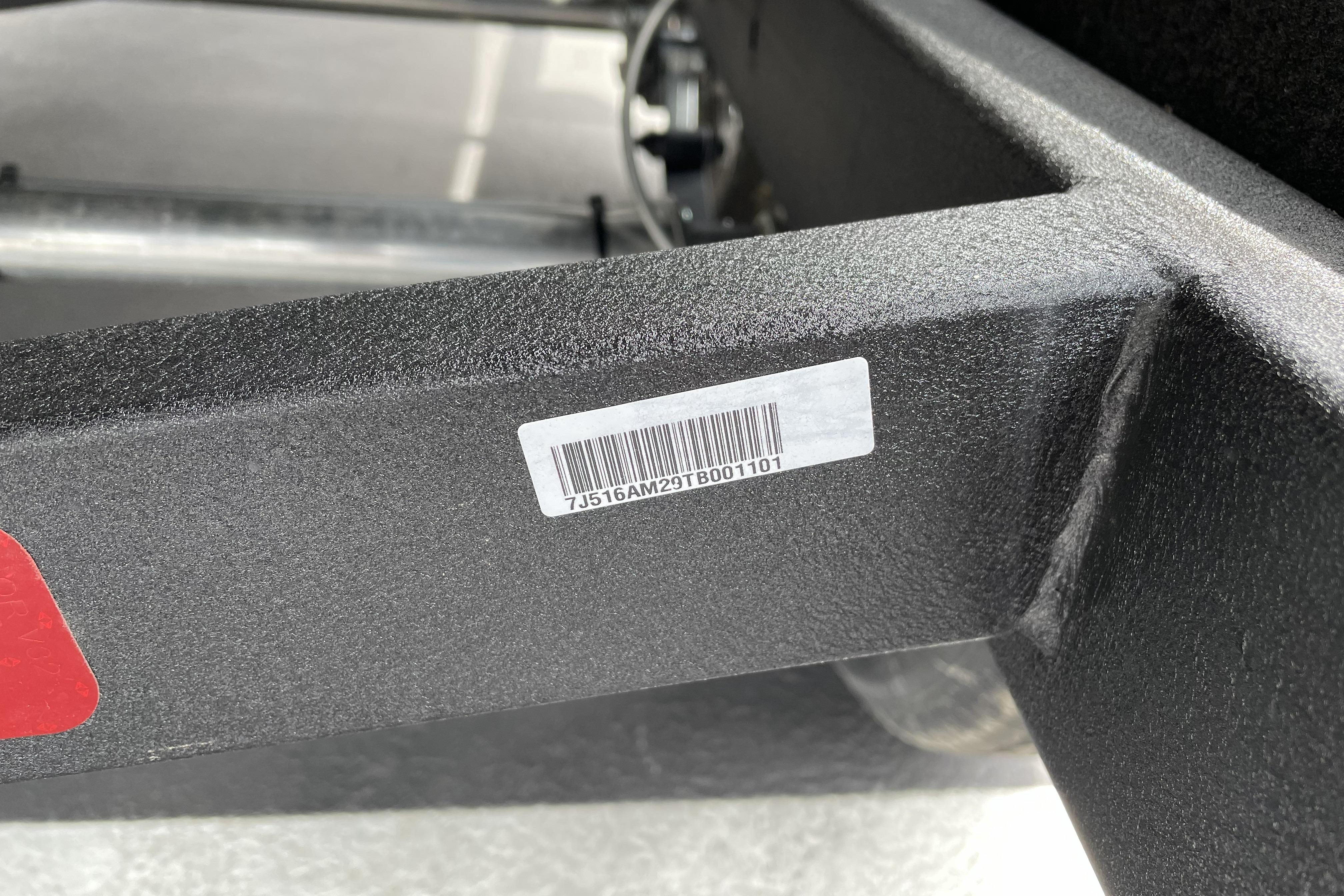 Barcode on 2026 Nitro Z21 XL boat trailer frame, close-up view.