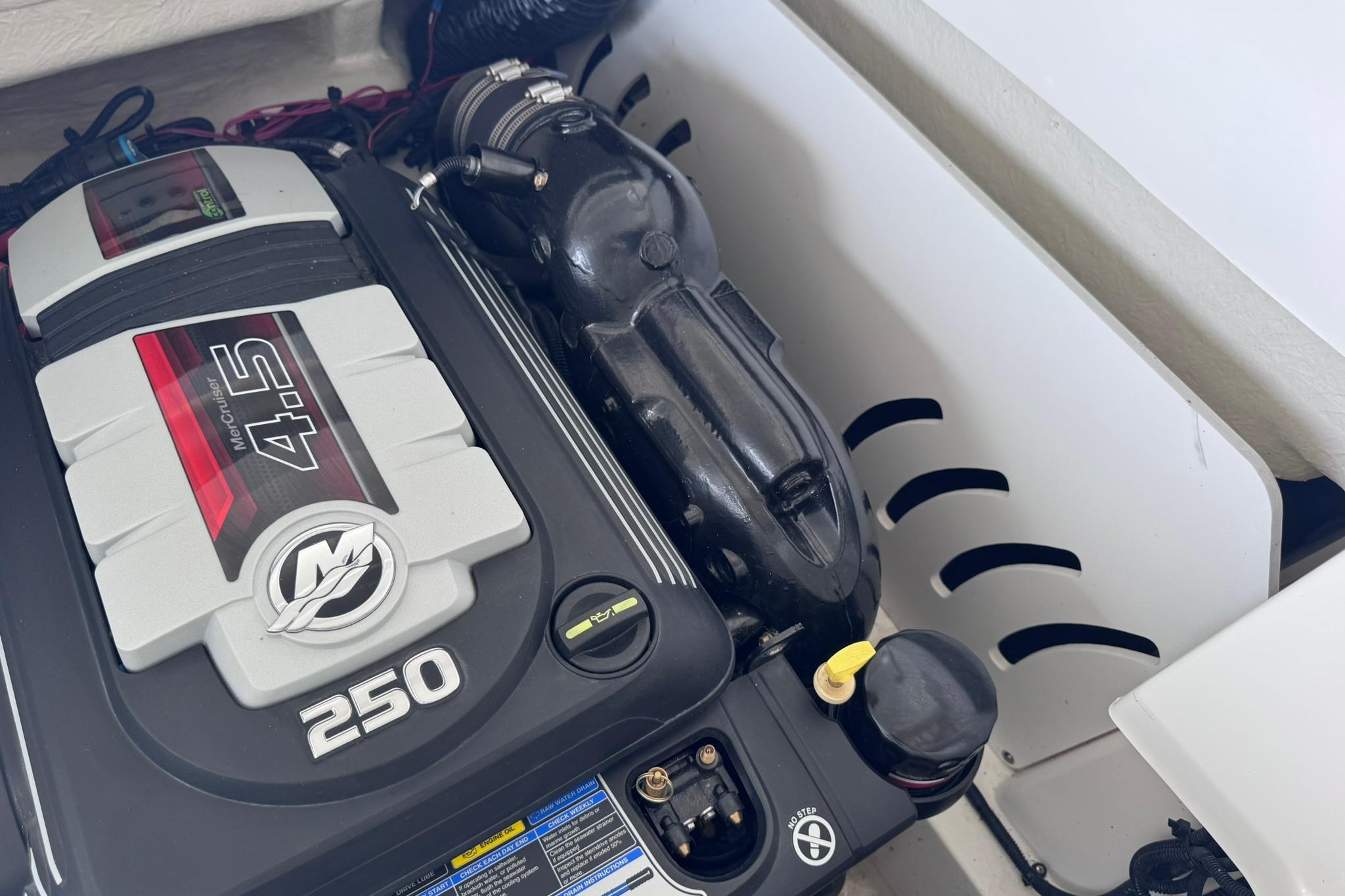 Engine compartment of a 2021 Sea Ray SPX 230 with MerCruiser 4.5L 250 HP engine.