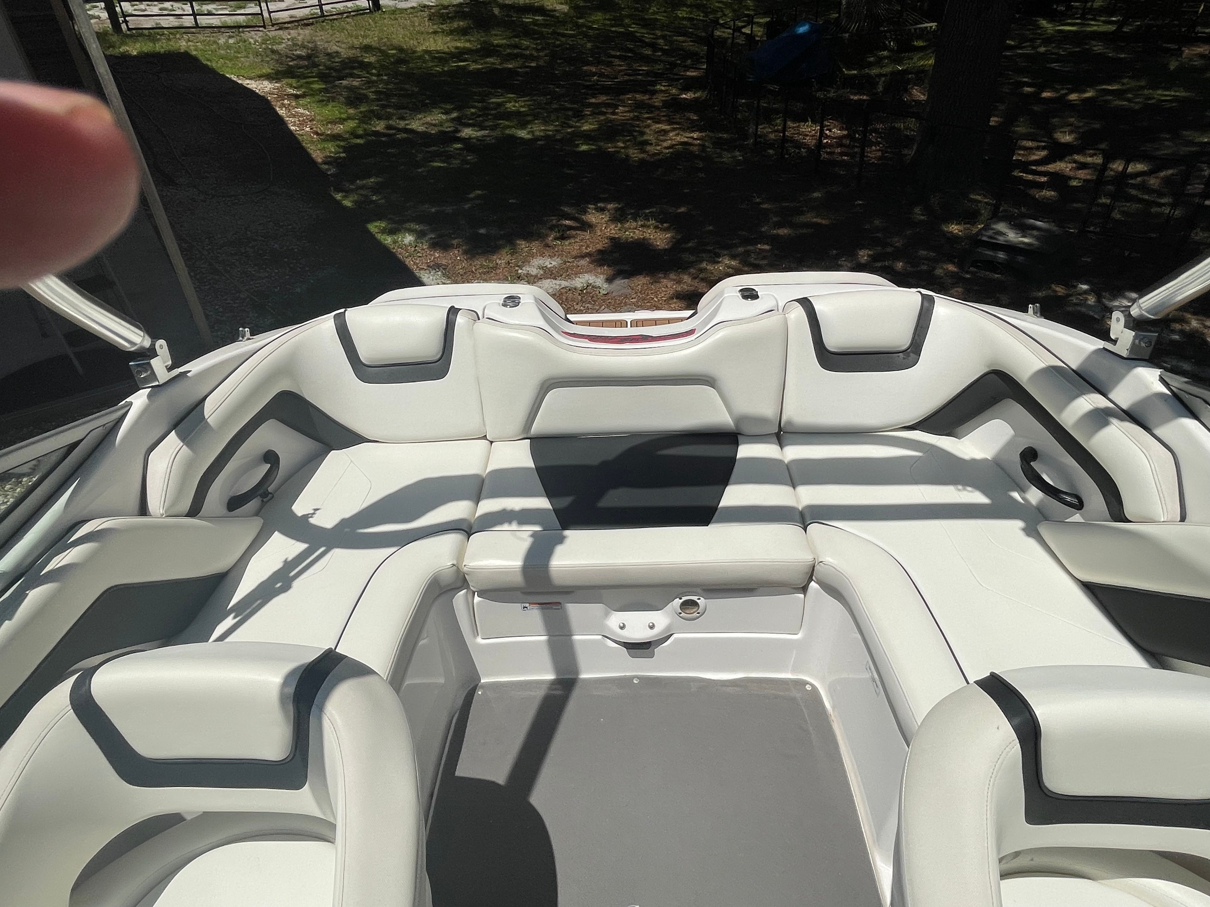 The image shows the interior of a 2015 Yamaha SX190 boat with white upholstery.