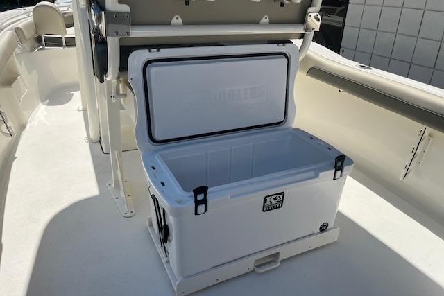 Open cooler on 2026 Key West 239 FS boat deck, showcasing spacious interior.
