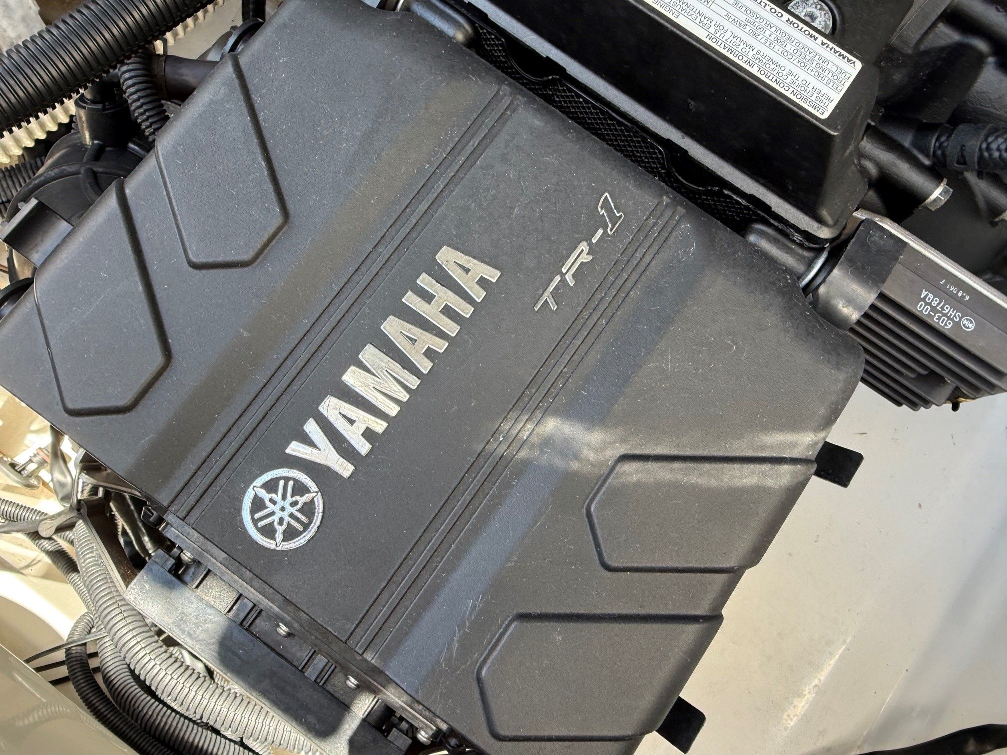 Close-up of a Yamaha TR-1 engine in a boat.
