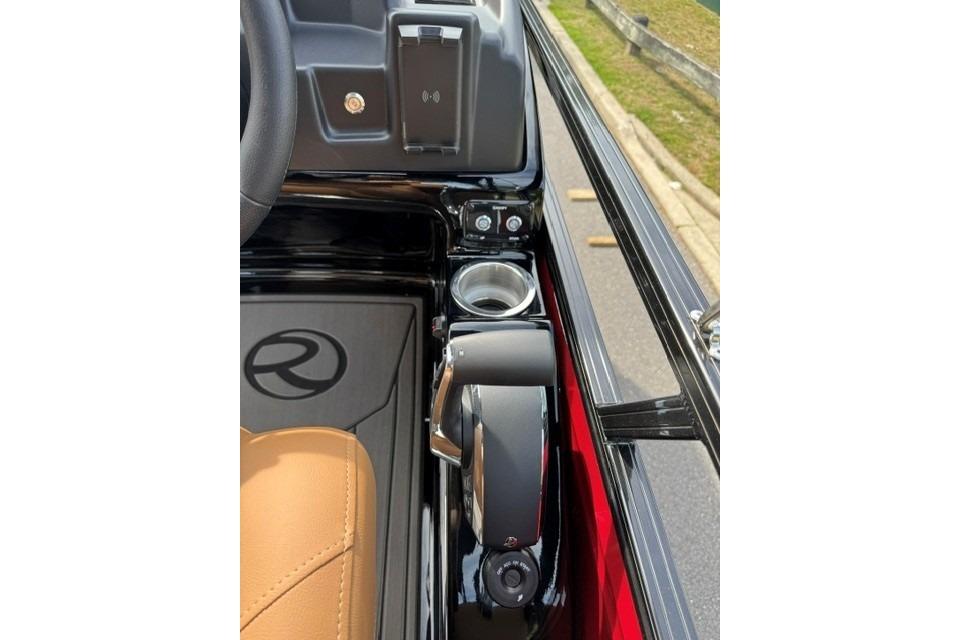2026 Regency 230 DL boat console with steering wheel, cup holder, and control panel.