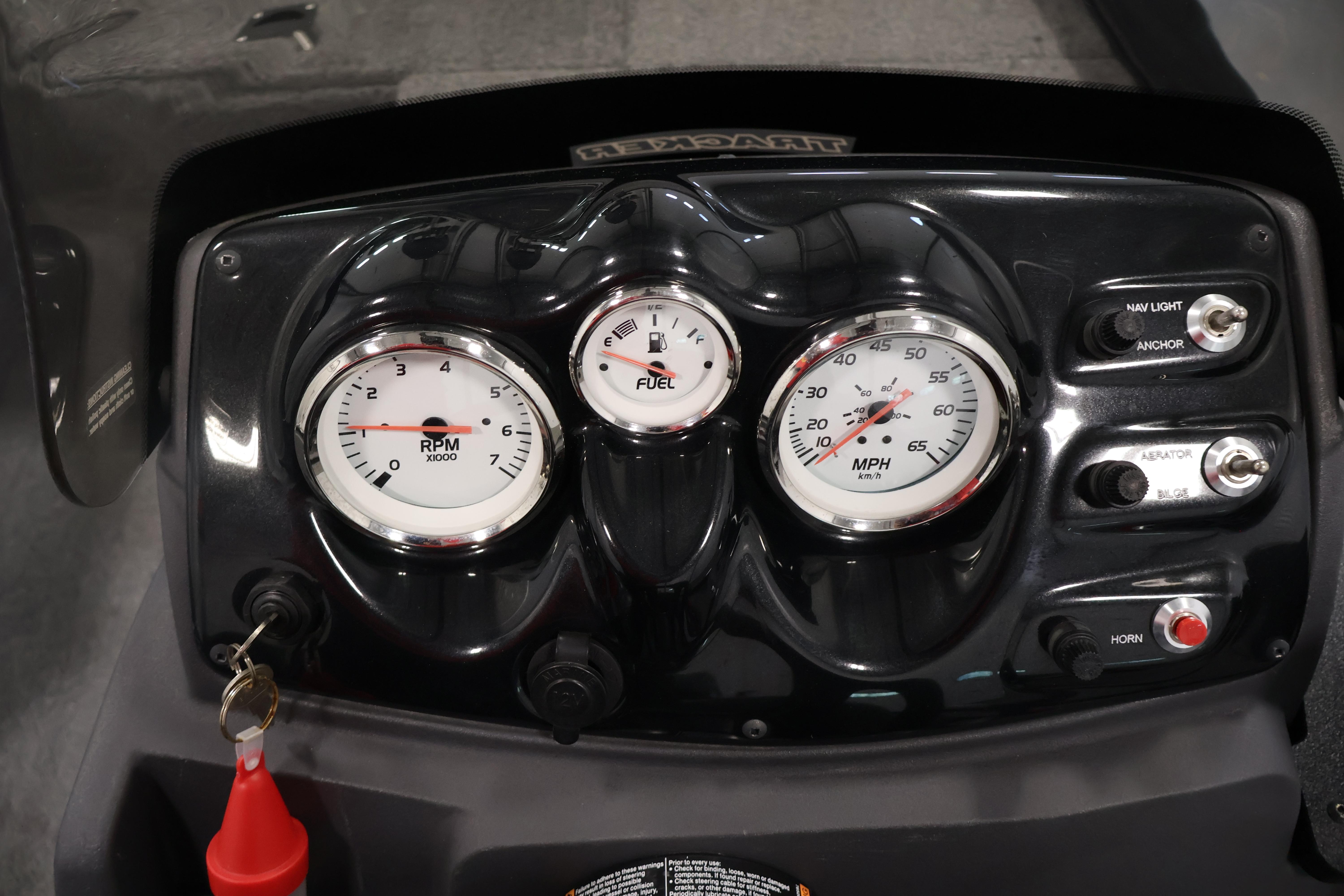 Dashboard of 2024 Tracker Pro 170 boat with gauges and switches.