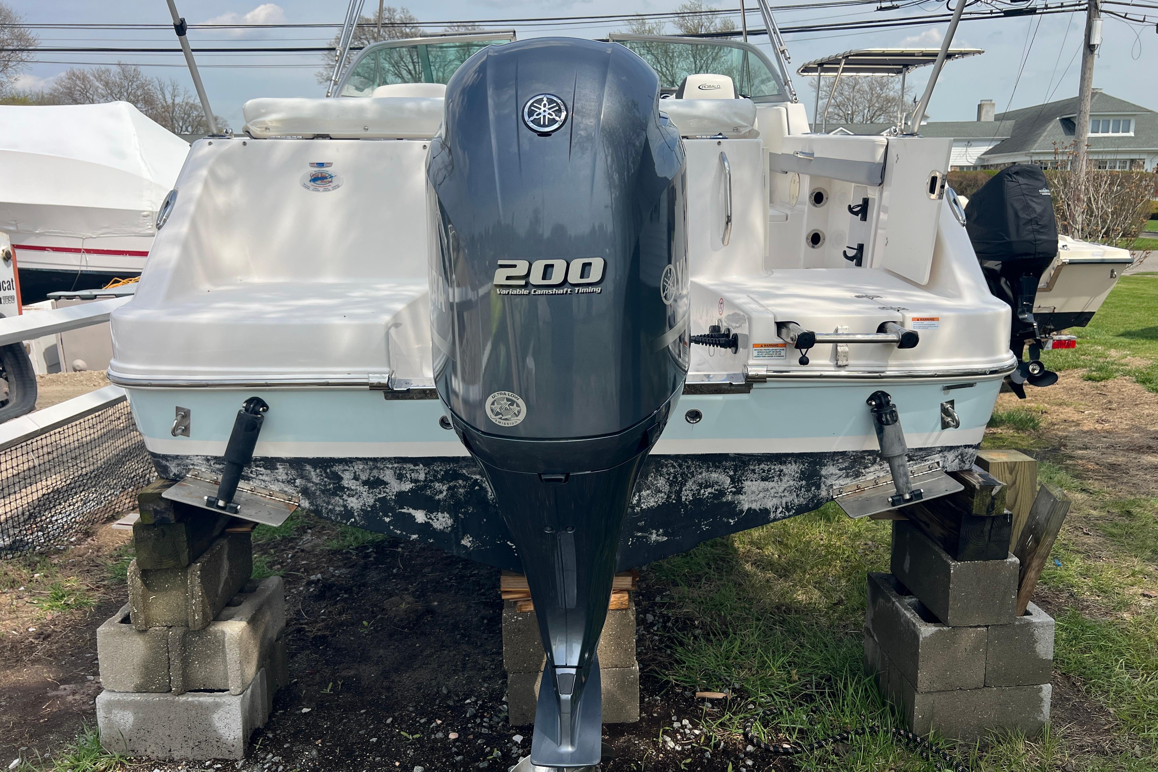 2022 Robalo R227 Dual Console boat with Yamaha 200 engine on blocks.