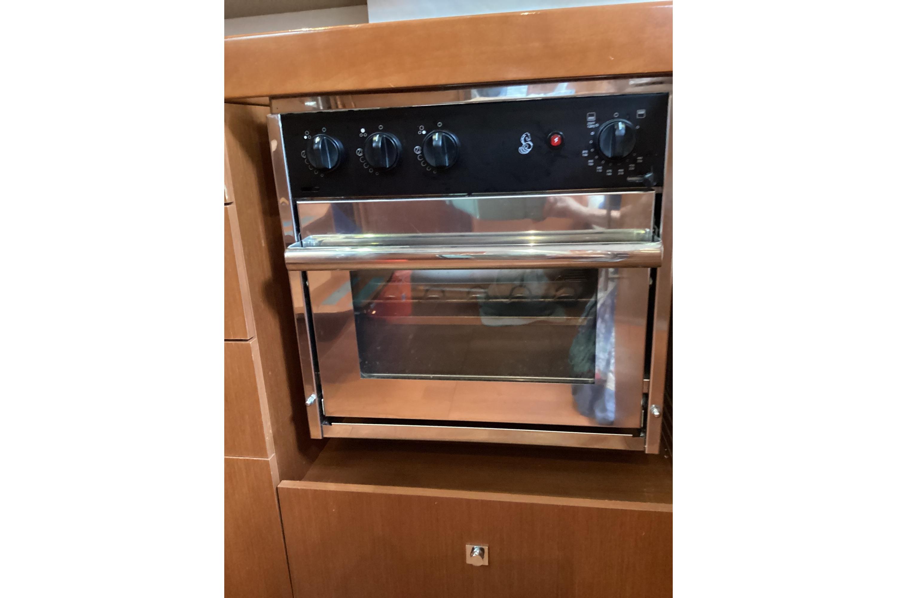 Built-in oven on 2012 Beneteau Oceanis 45 yacht, featuring stainless steel finish and control knobs.