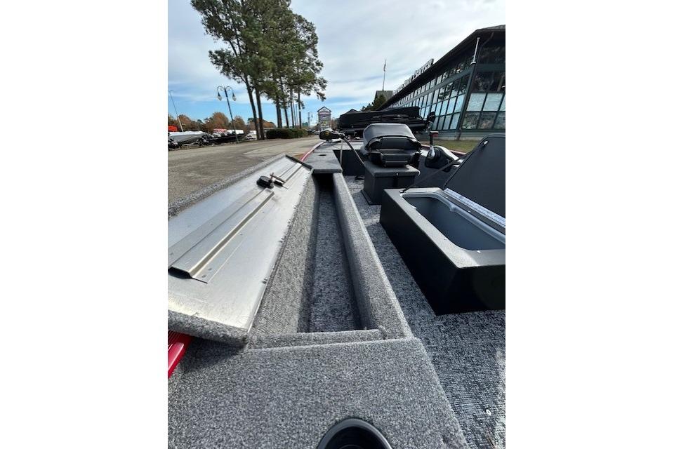 2025 Tracker Panfish 17 boat interior with storage compartments and seating, outdoors.