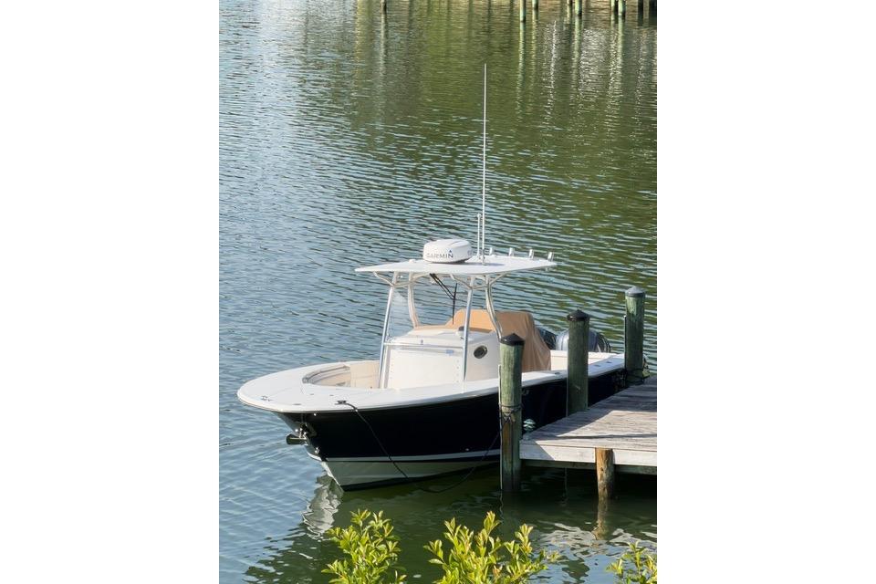 2014 Southport 29 FE boat docked on calm water, featuring a sleek design.