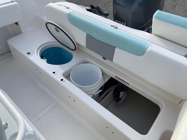 2024 Robalo R202 Explorer boat storage compartments and seating area.