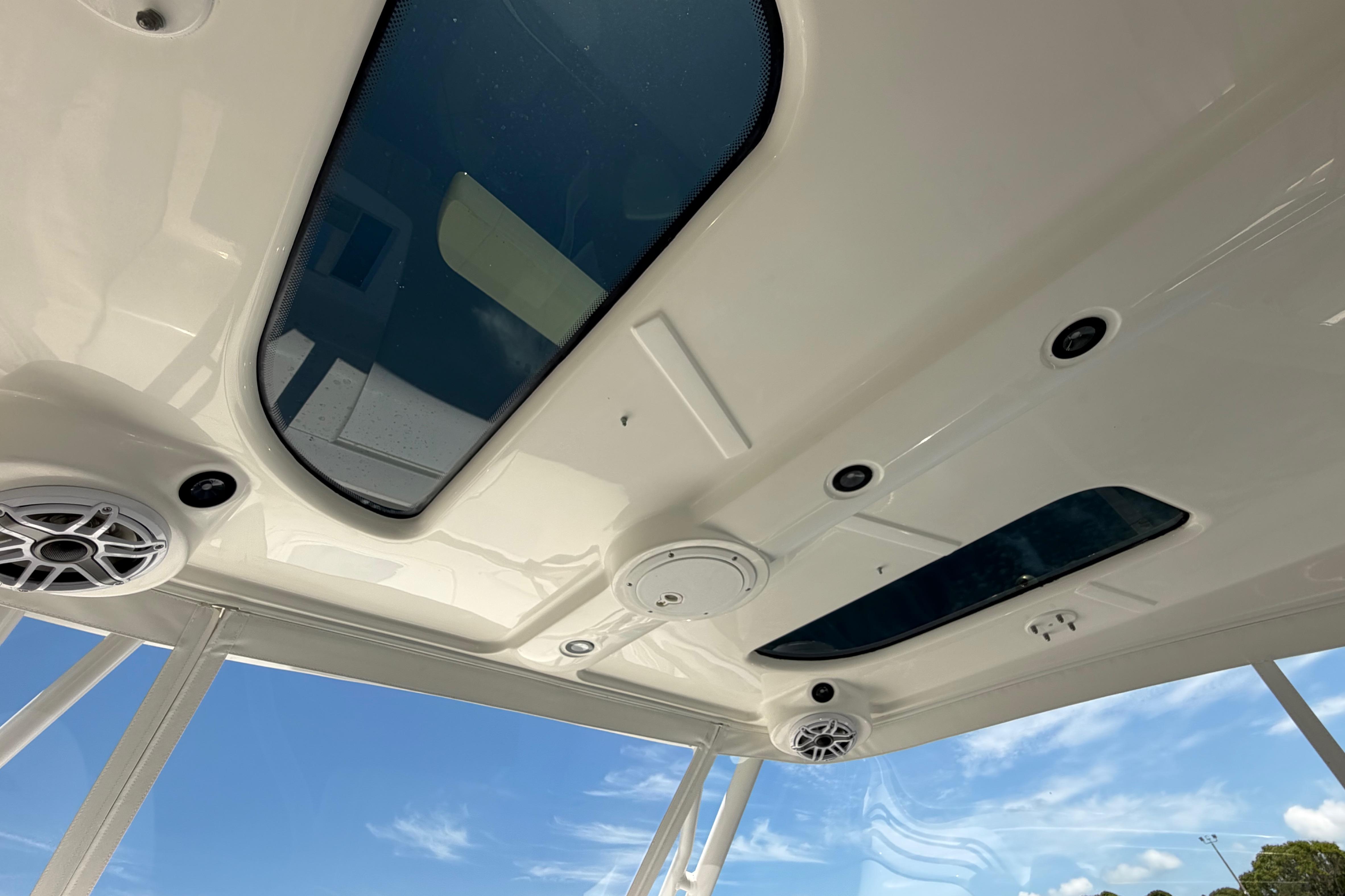 Interior view of 2009 Everglades 350LX boat roof with skylights and speakers.