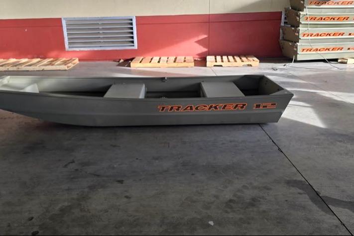 2026 Tracker Grizzly 12 Jon boat in a warehouse setting.