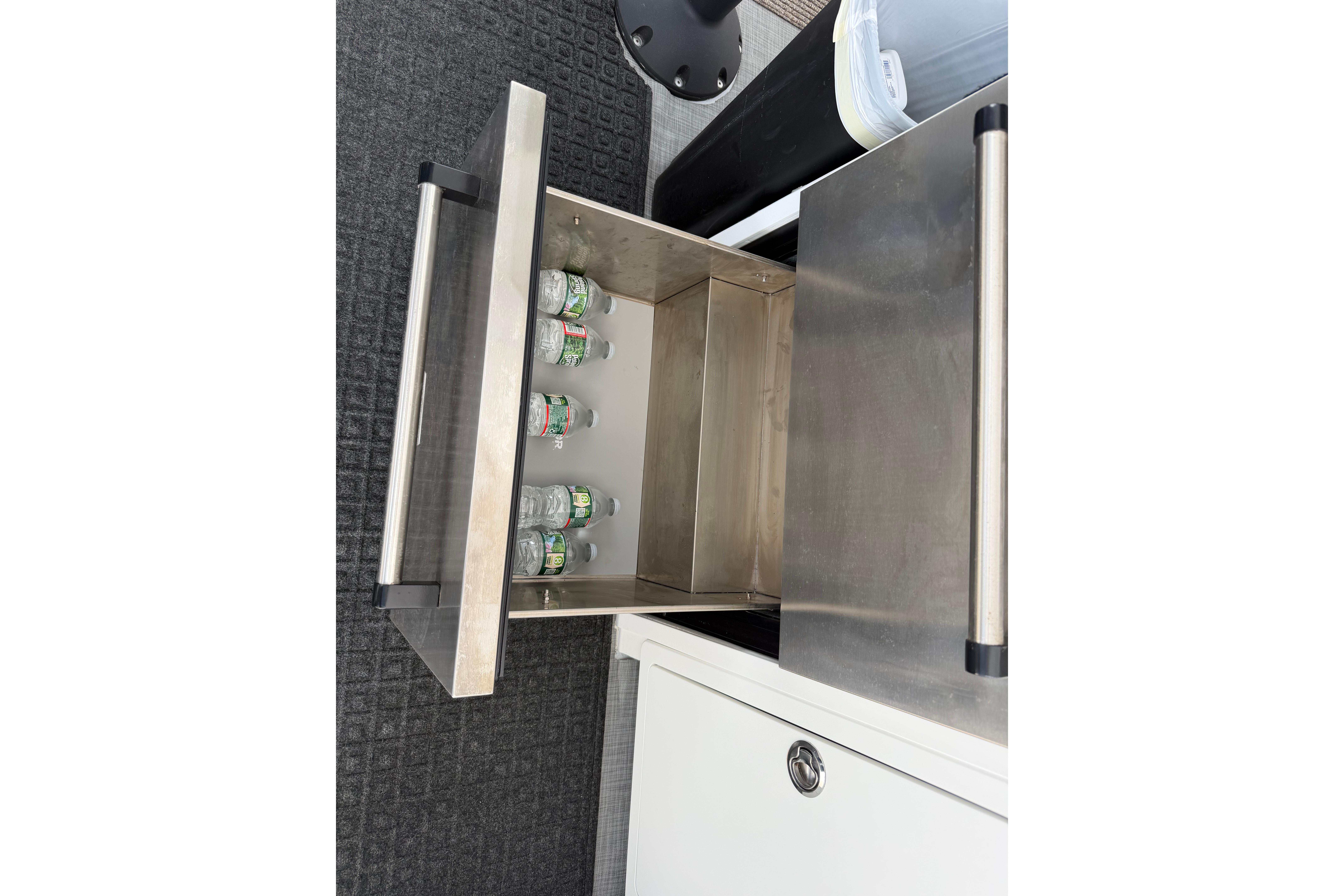 Stainless steel drawer with water bottles on H&H Marine Osmond Beal boat, 2018 model.