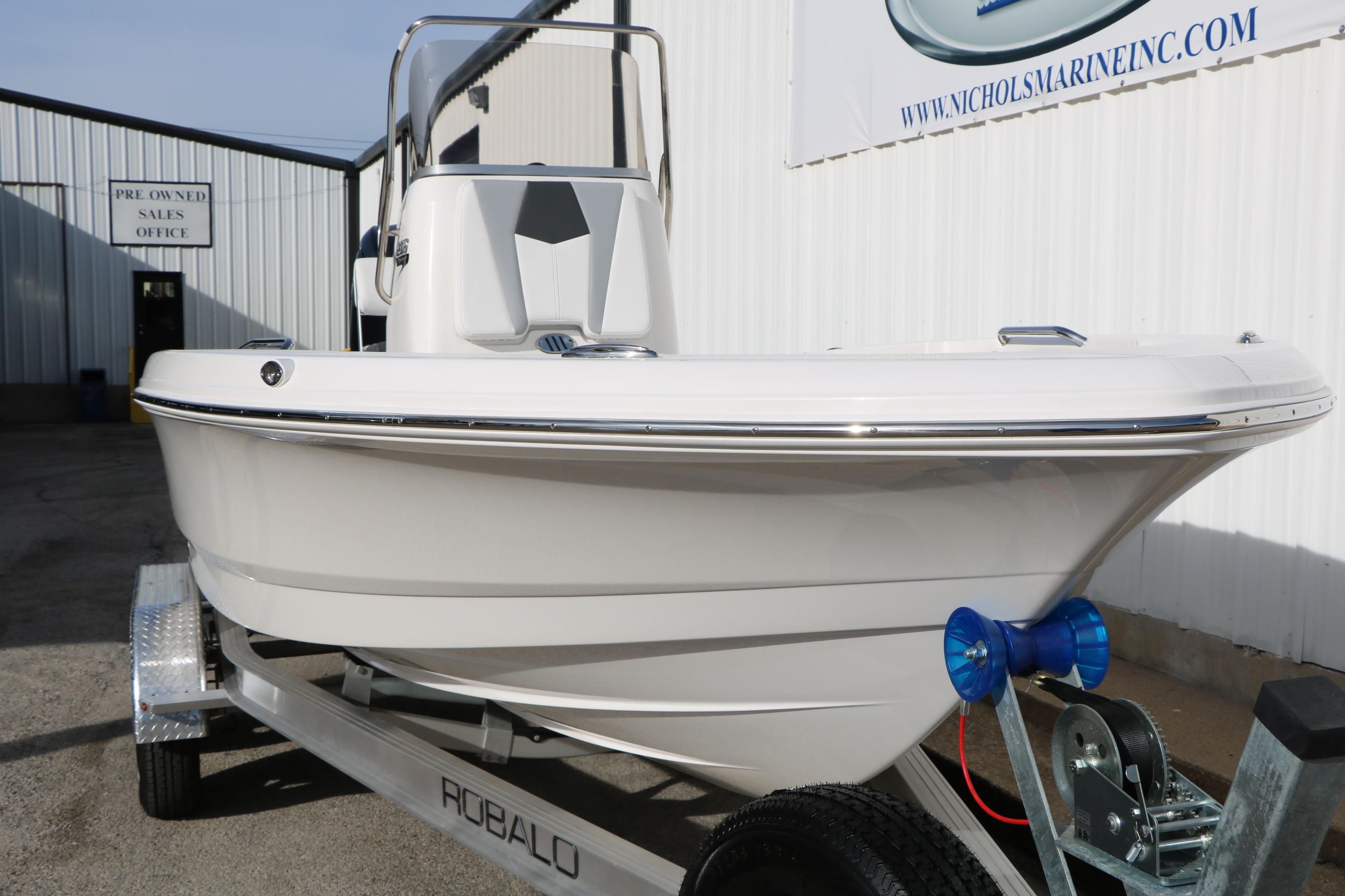 2026 Robalo 206 Cayman boat on trailer outside sales office.