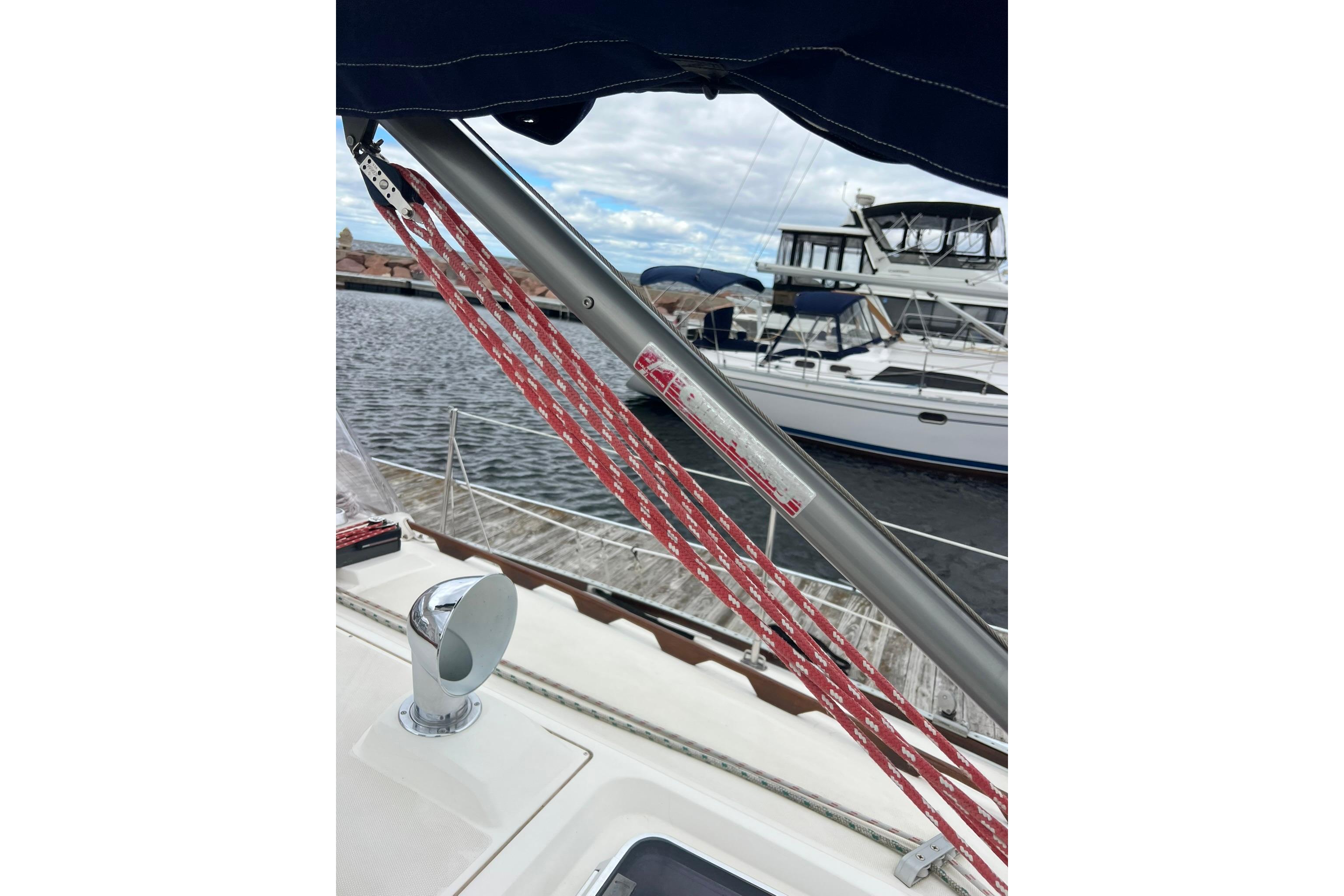 Sailboat deck view with rigging, Sabre 362, 1998 model, docked at marina.