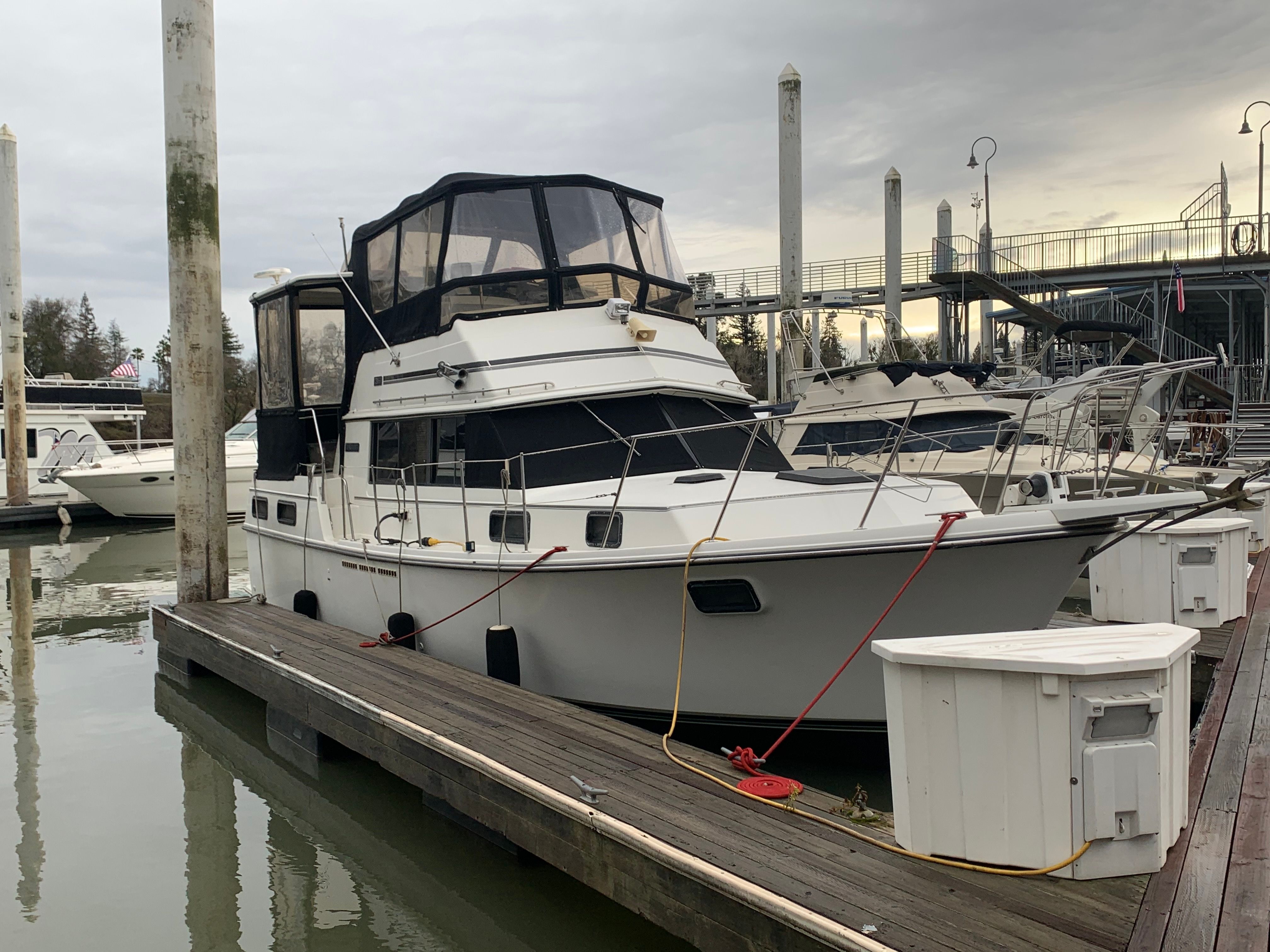 1988 Carver 3607 Aft Cabin Motor Yacht docked at a marina.