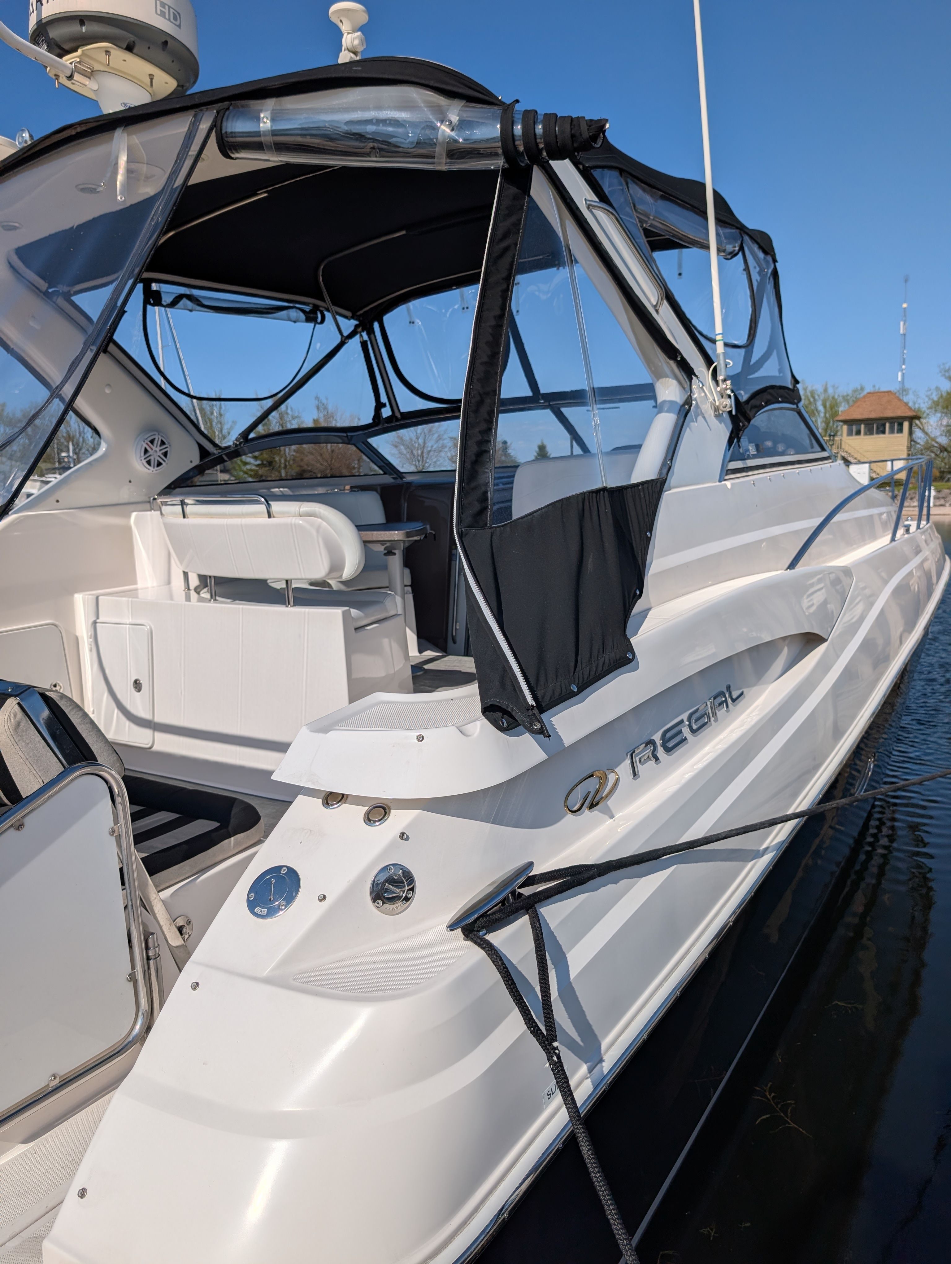 2005 Regal Commodore 3560 yacht docked on water.