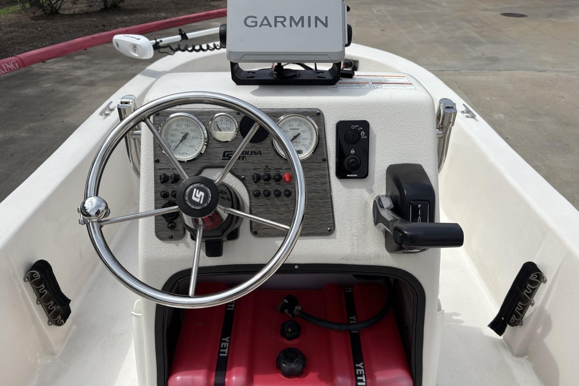 2024 Carolina Skiff E18 JVX CC boat dashboard with Garmin navigation system.