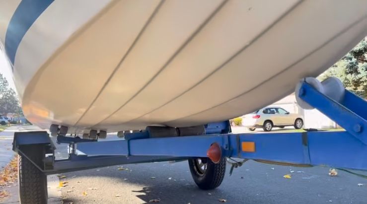 Underside of a 1962 Larsen 13 boat on a trailer.