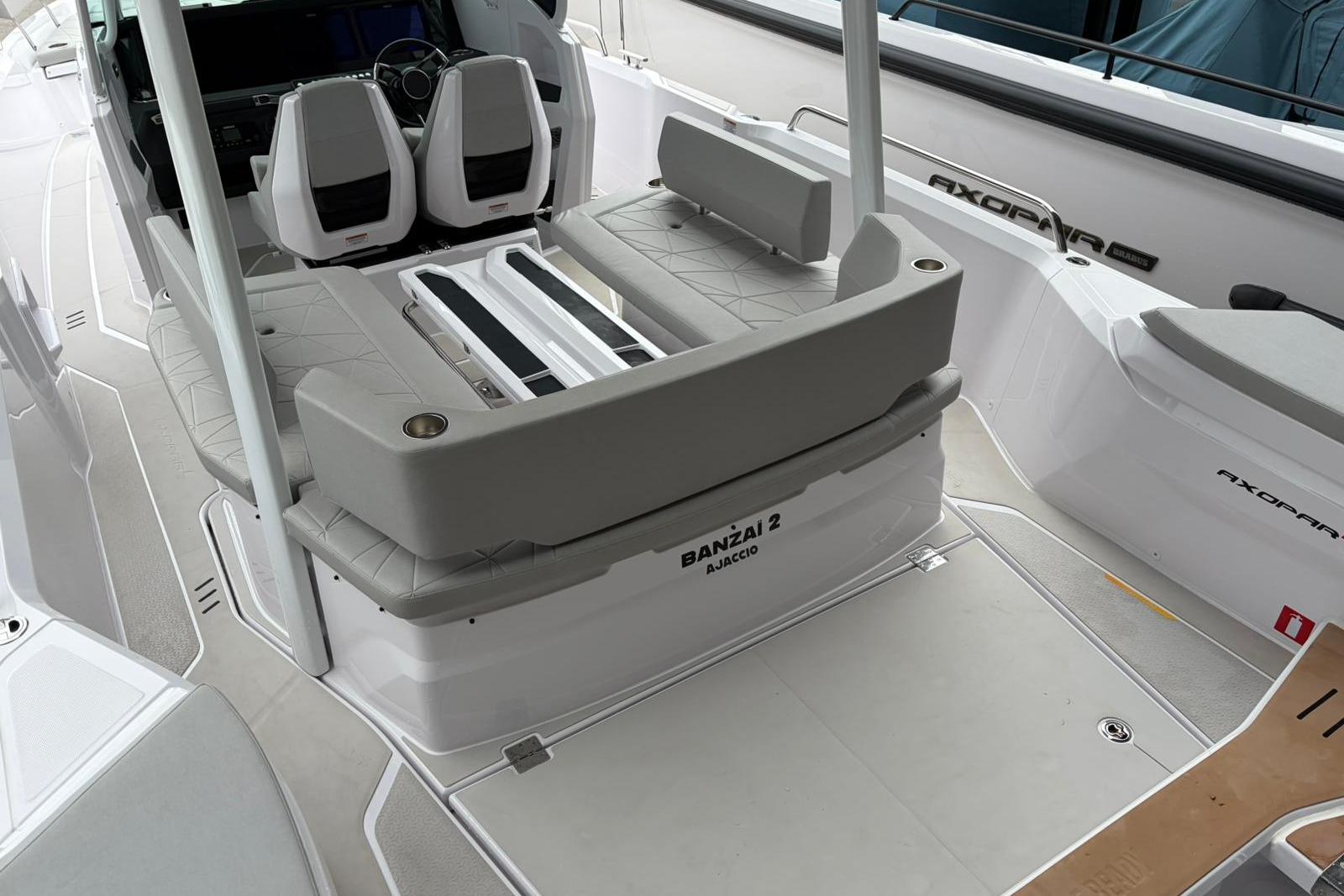2025 Axopar 29 Sun-Top boat interior with seating and steering wheel.