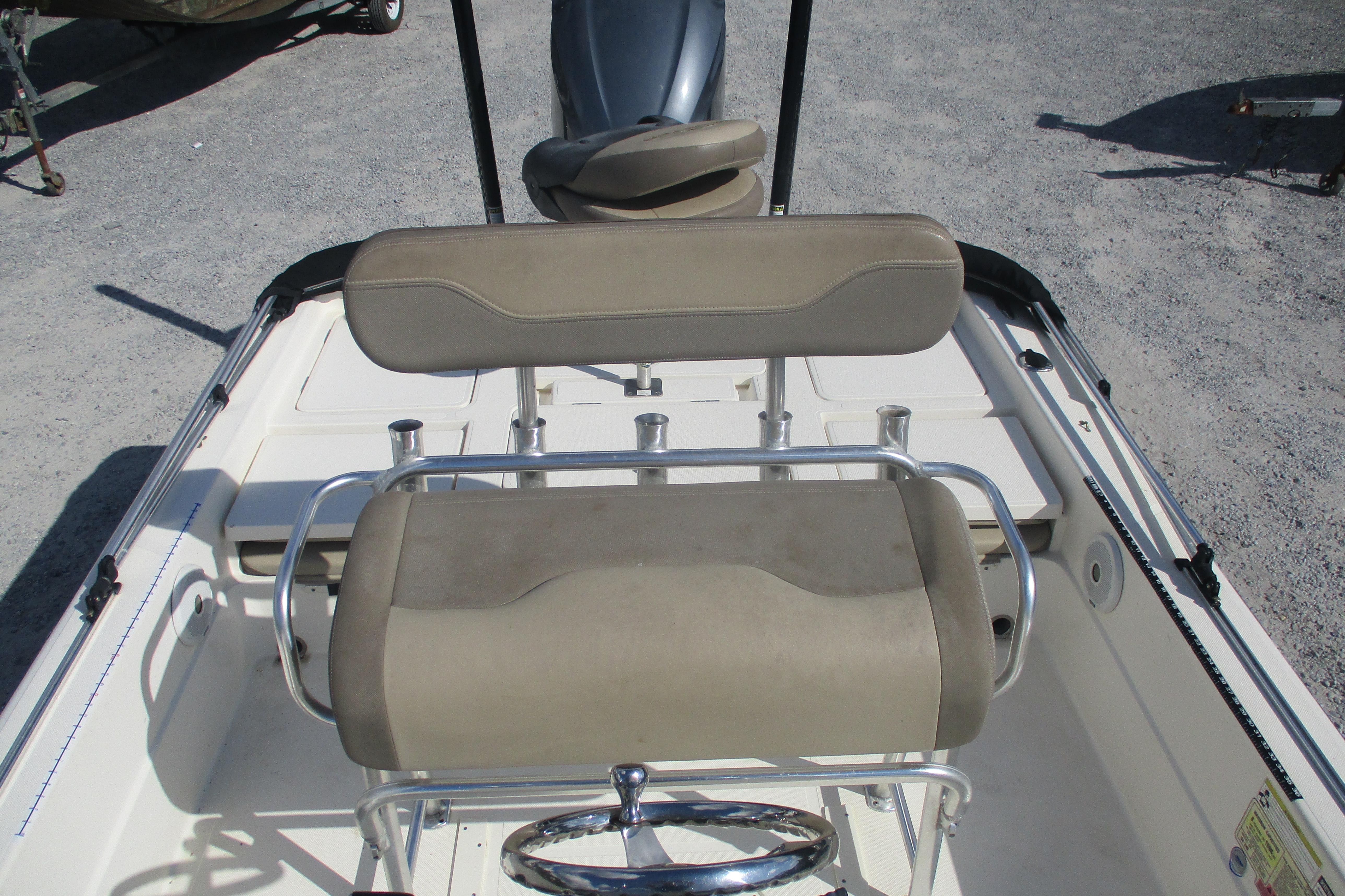 2014 Skeeter SX240 boat interior with beige seating and steering wheel.
