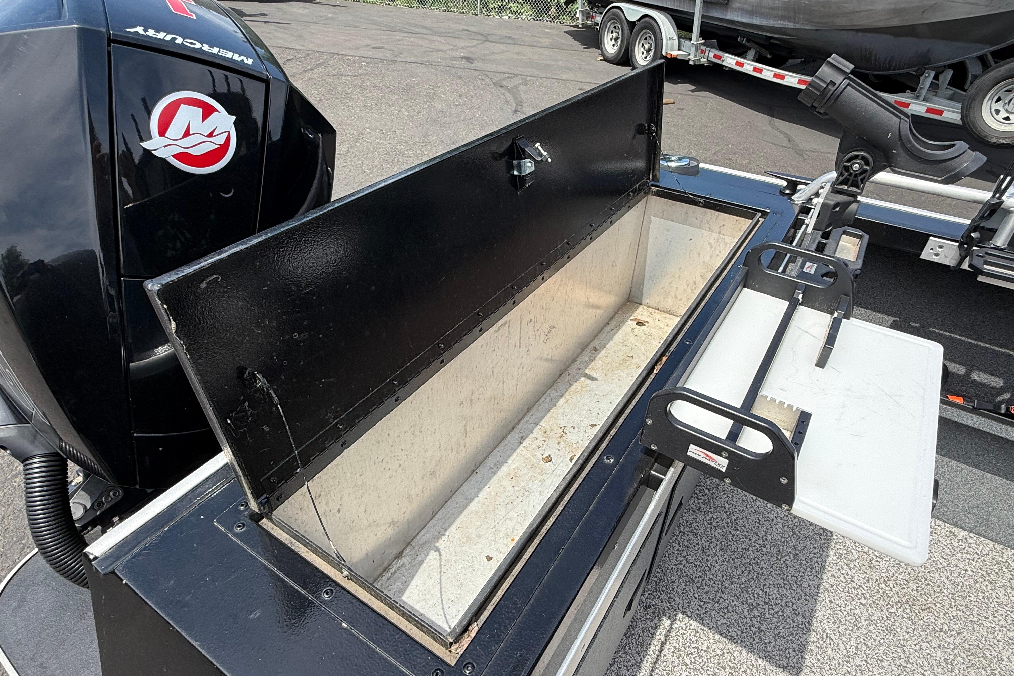2019 Alumaweld Intruder Hard Top 22' boat with open storage compartment and Mercury engine.