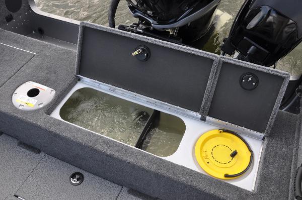 Manufacturer Provided Image: 2019 Lund 2175 Pro-V boat with open storage compartments and motor in water.