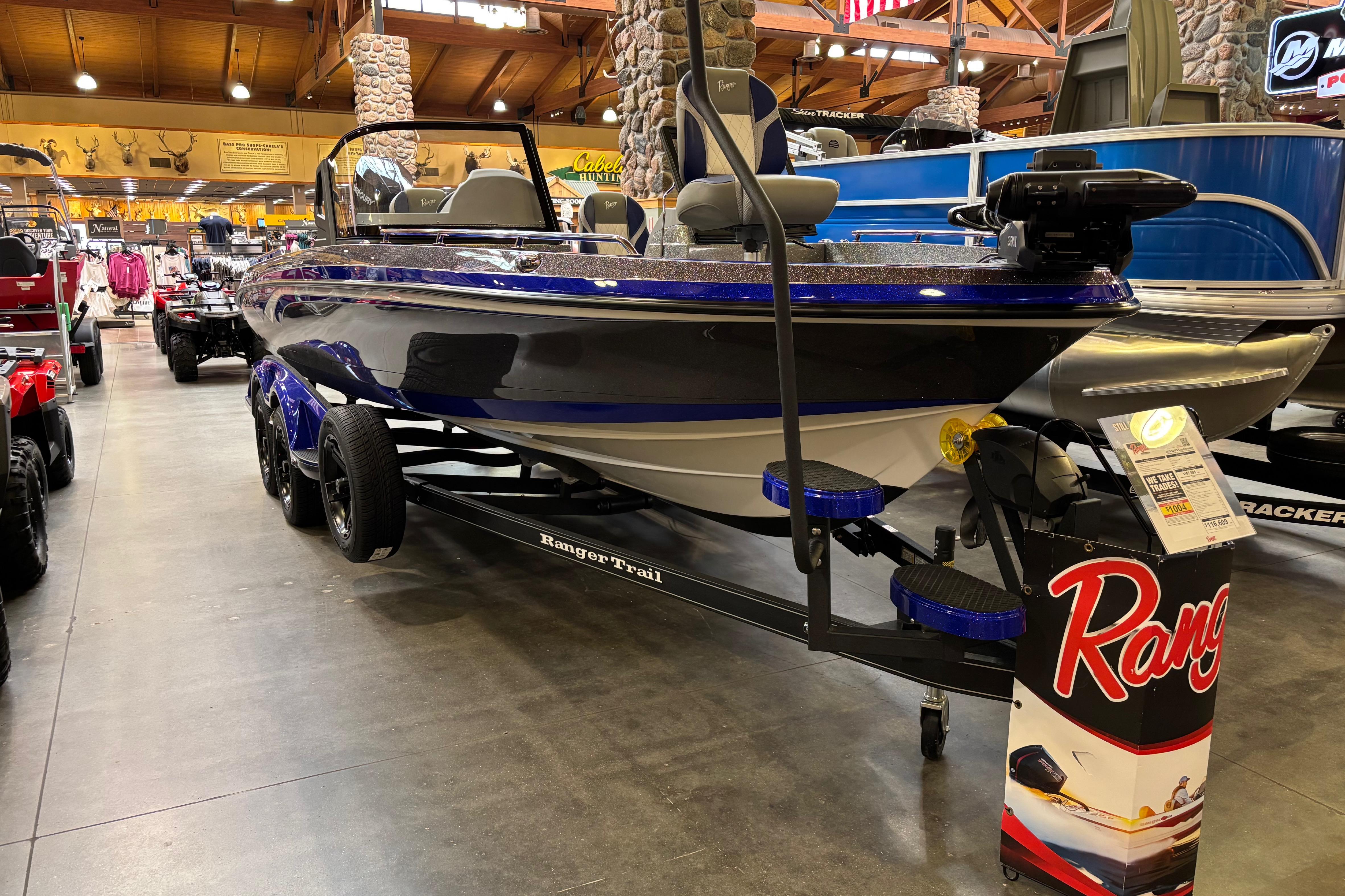 2026 Ranger 621FS Cup-Equipped boat displayed in a showroom with wooden ceiling.