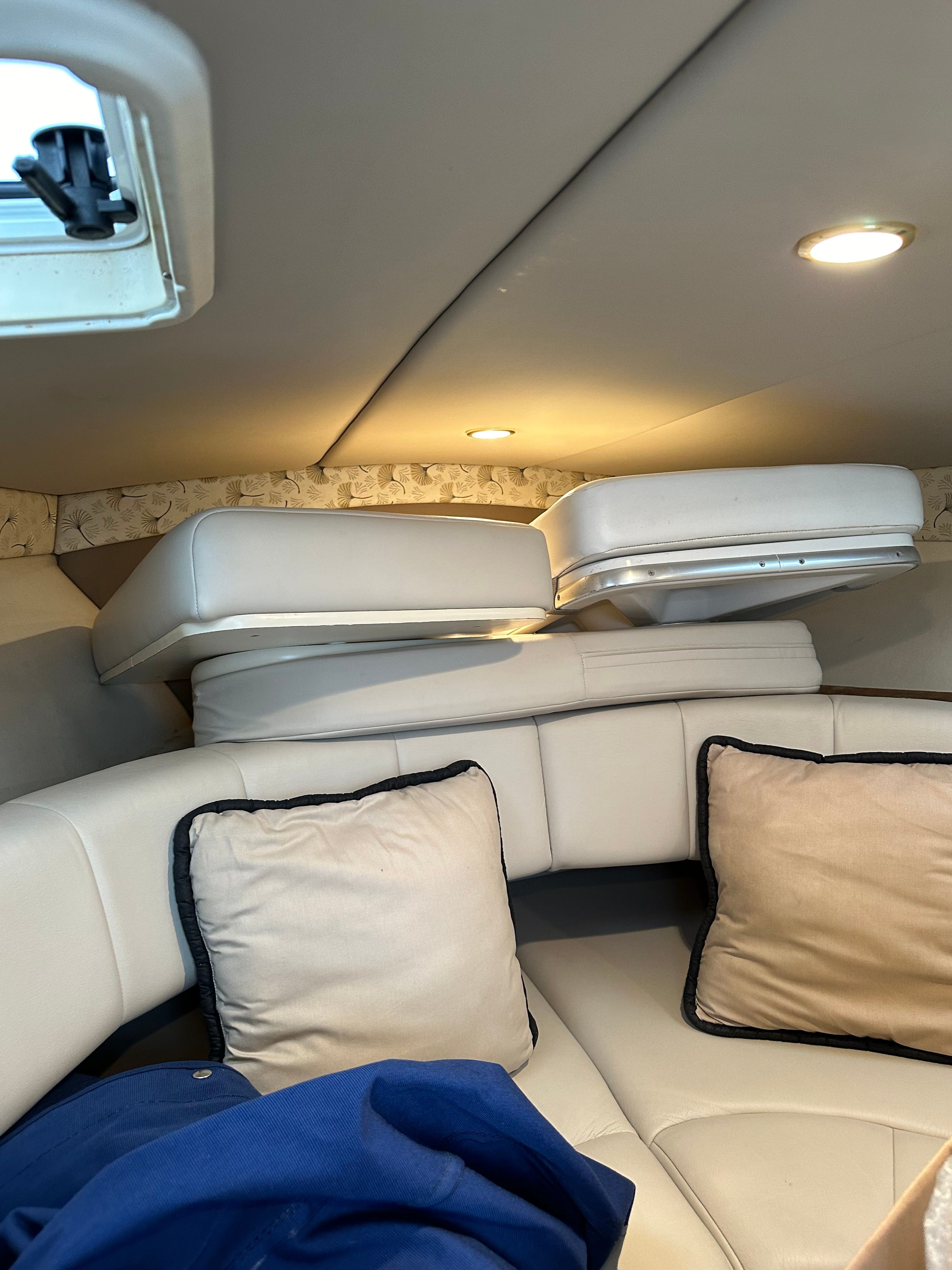 Interior of a 2000 Formula 260 Sun Sport boat with cushions.