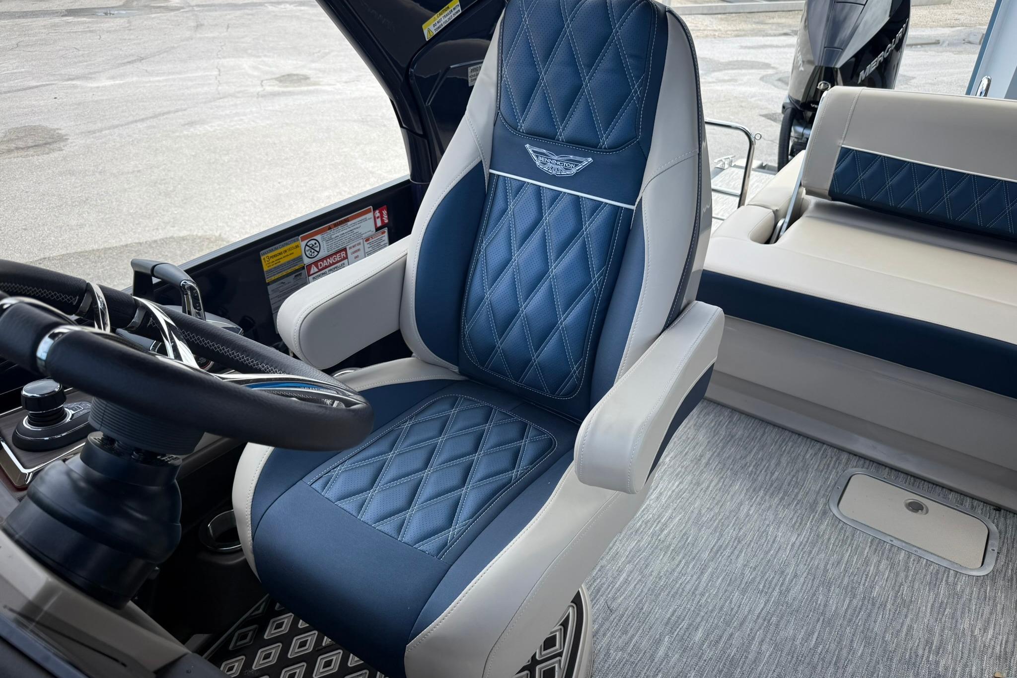 Luxury seating in 2026 Bennington 27 QSBAT2 boat, featuring diamond-stitched upholstery and modern design.