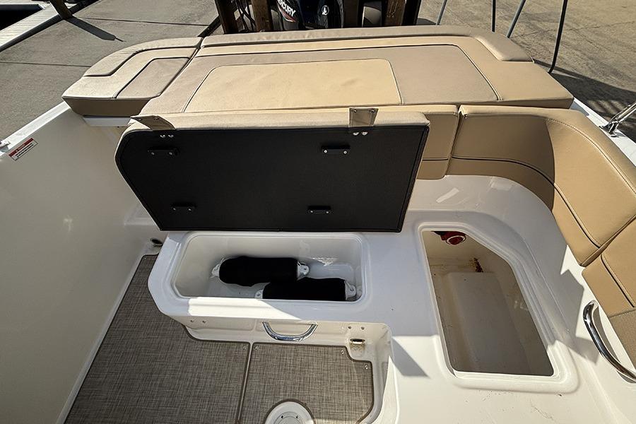 2023 Bayliner VR5 Bowrider OB boat interior with open storage compartments.
