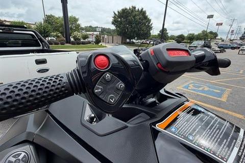 2025 Sea-Doo RXT-X 325 handlebar controls in a parking lot setting.