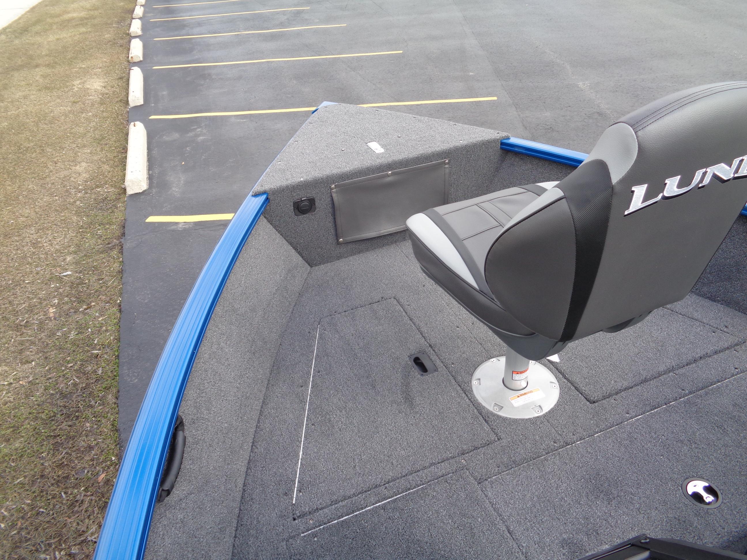 2024 Lund 1650 Rebel XL Sport boat interior with seating and storage compartments.