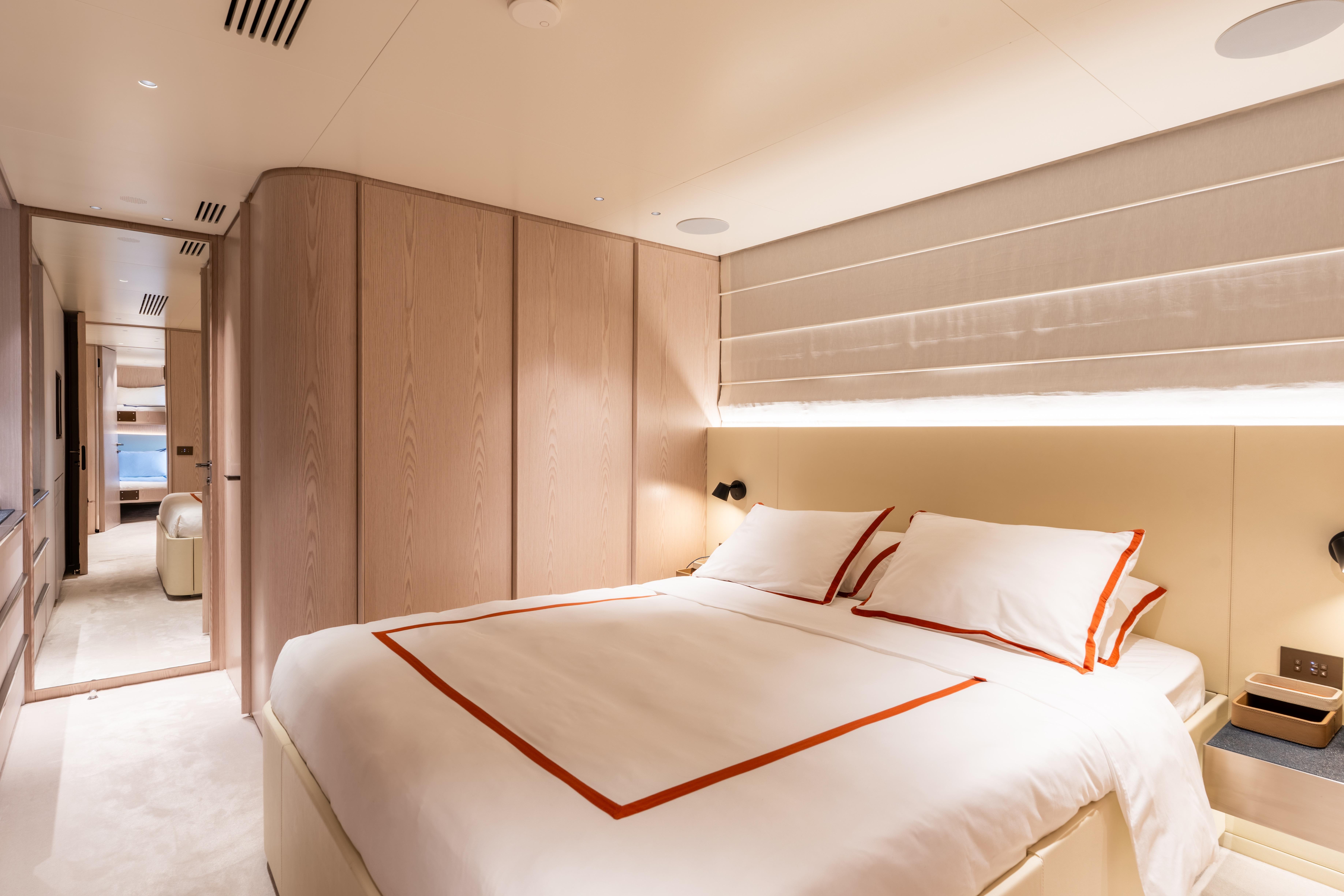 Luxurious bedroom interior of 2024 Benetti Oasis yacht with elegant design and modern amenities.