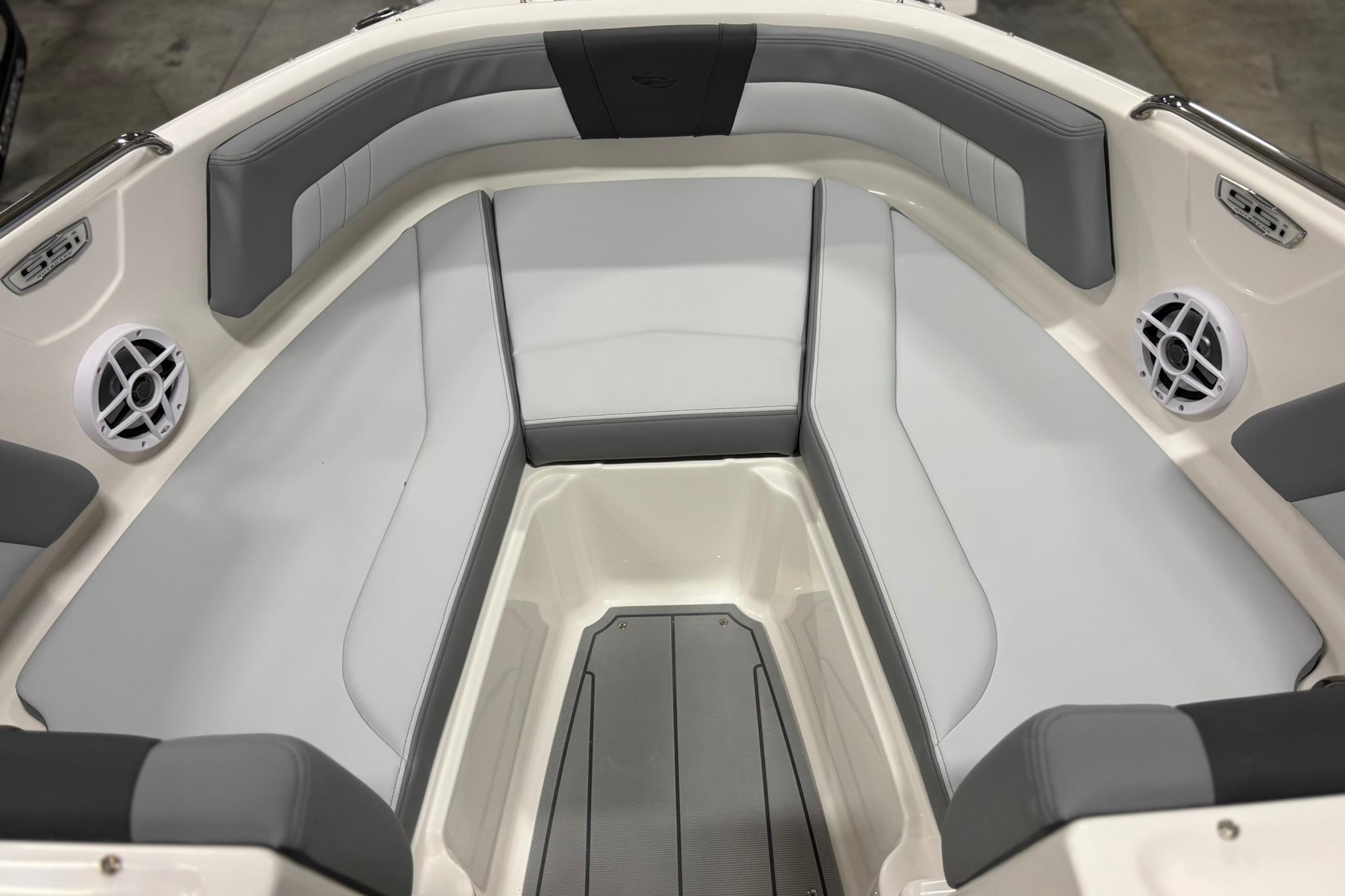 2026 Chaparral 21 SSi OB boat interior with gray seating and speakers.