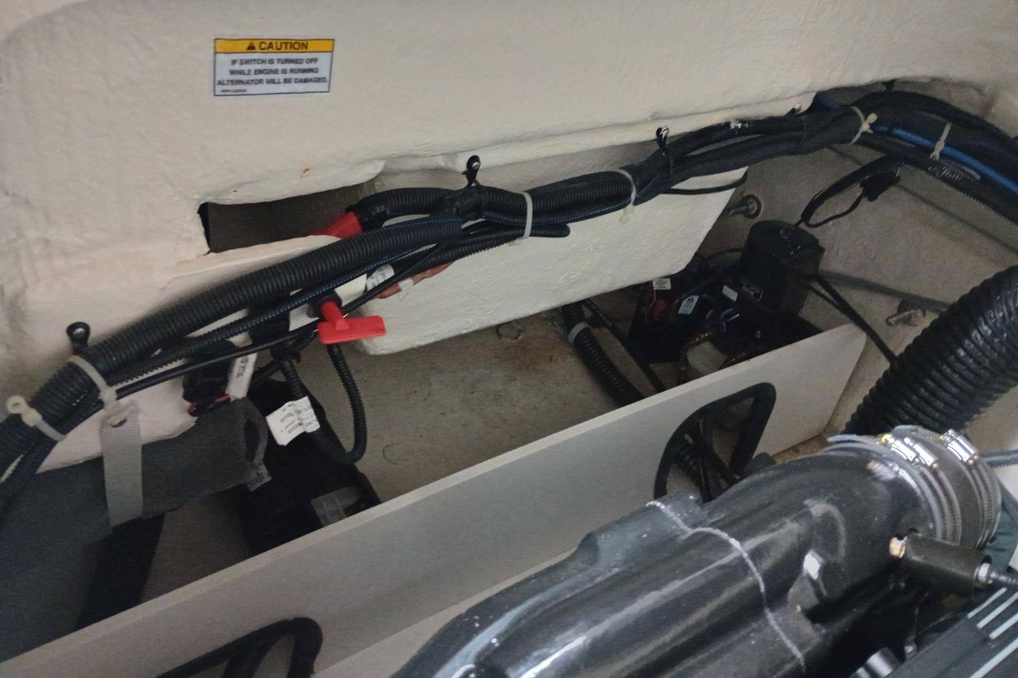 2022 Bayliner VR5 Bowrider I/O engine compartment with wiring and components.